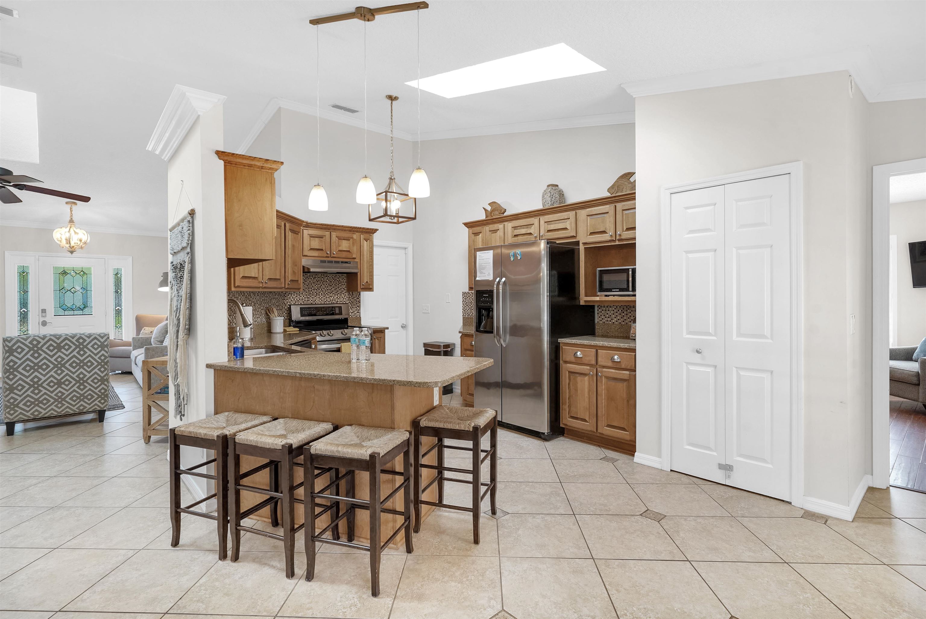 404 Fourteenth Street St. Augustine, FL 32084 - Photo 3 of 35 a large kitchen with a table and chairs in it