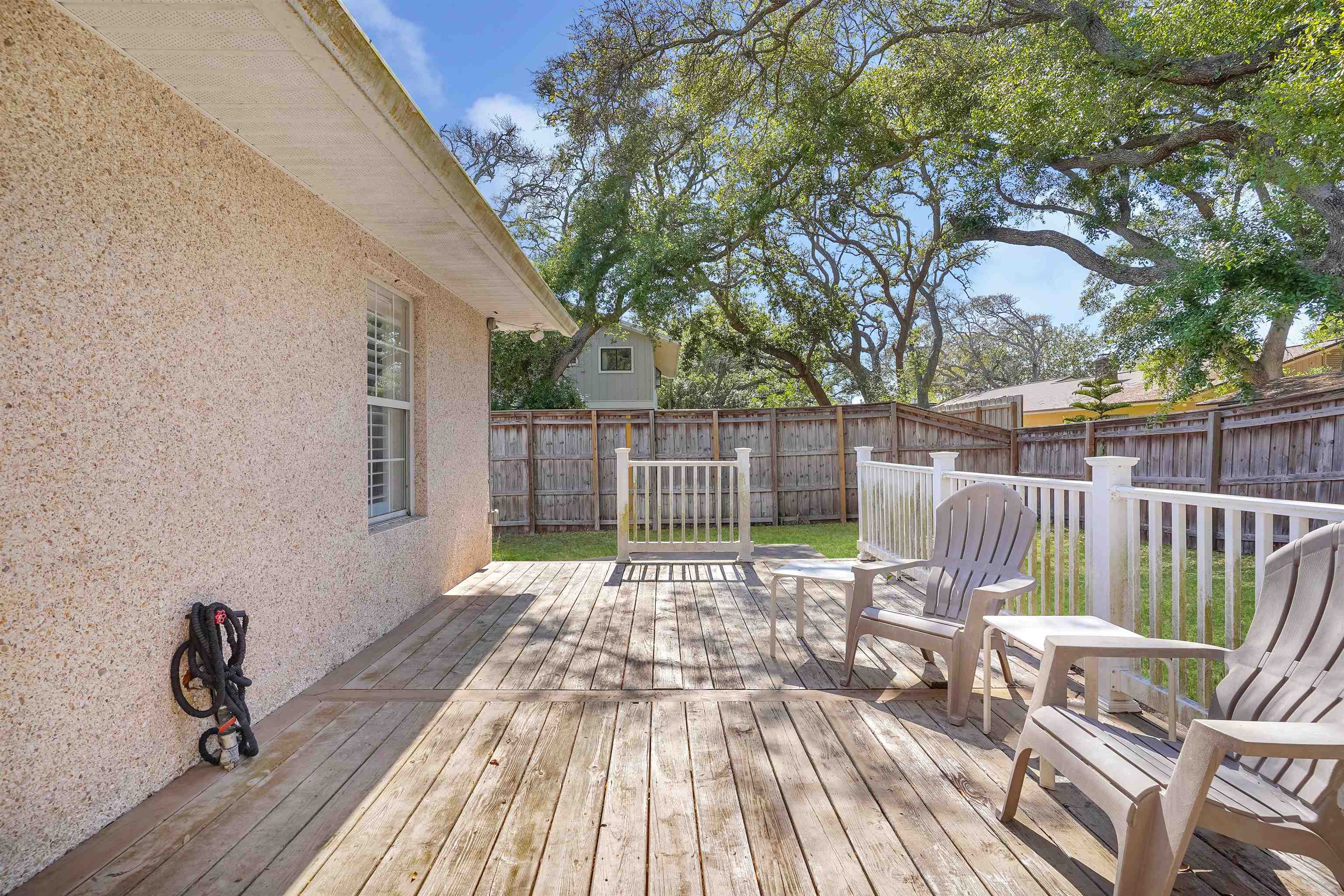 404 Fourteenth Street St. Augustine, FL 32084 - Photo 32 of 35 a view of a deck with wooden floor and outdoor seating
