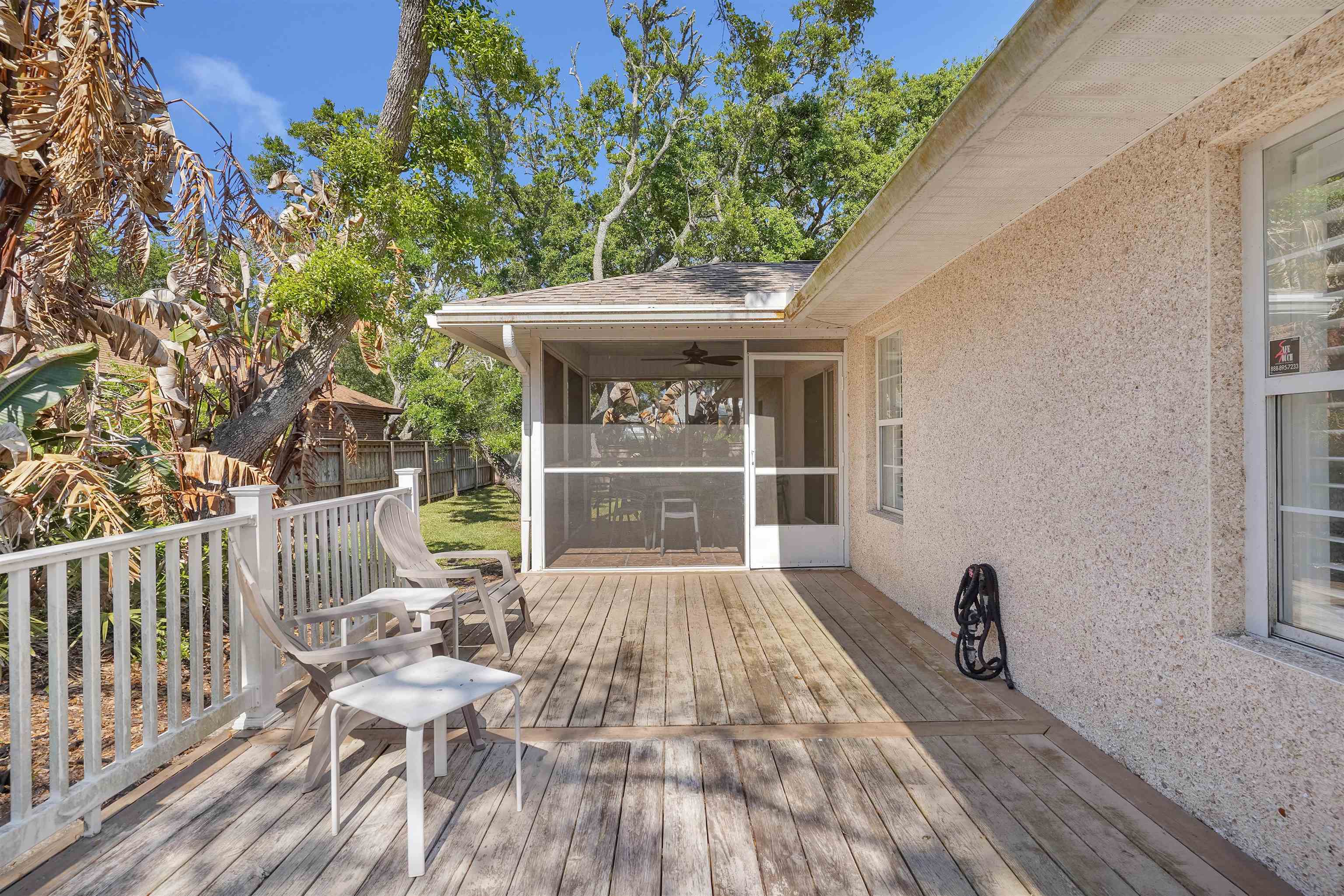 404 Fourteenth Street St. Augustine, FL 32084 - Photo 33 of 35 a view of balcony with wooden floor and outdoor seating