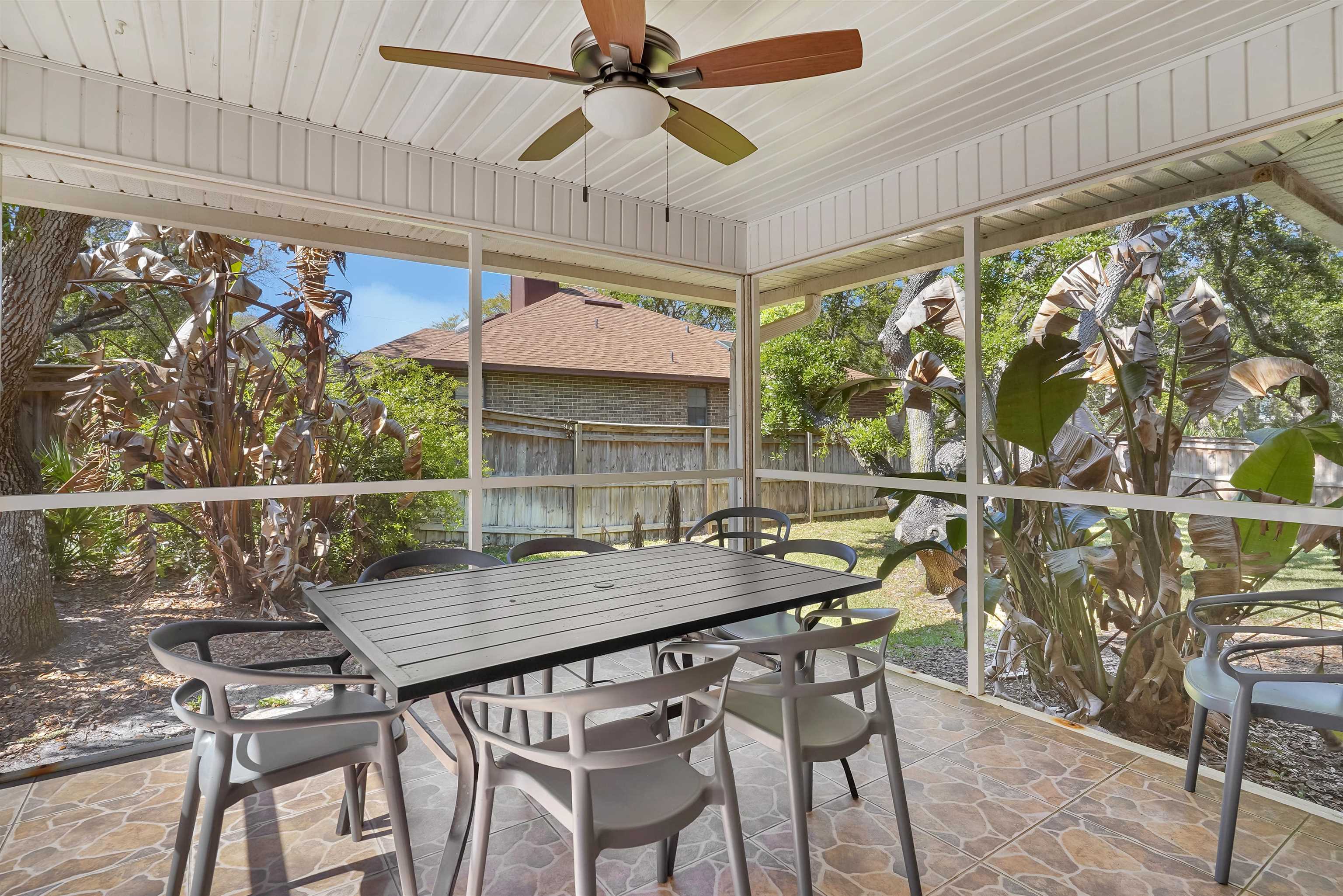 404 Fourteenth Street St. Augustine, FL 32084 - Photo 5 of 35 a view of a table and chairs in patio