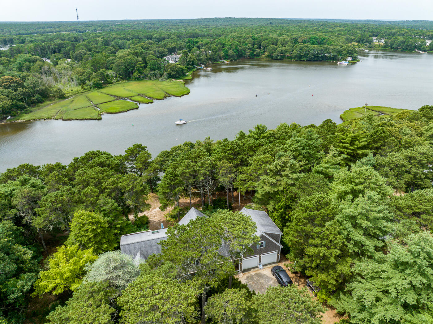 25 Fairmount Road South Dennis, MA 02660 - Photo 2 of 61 an aerial view of green landscape with trees houses and lake view