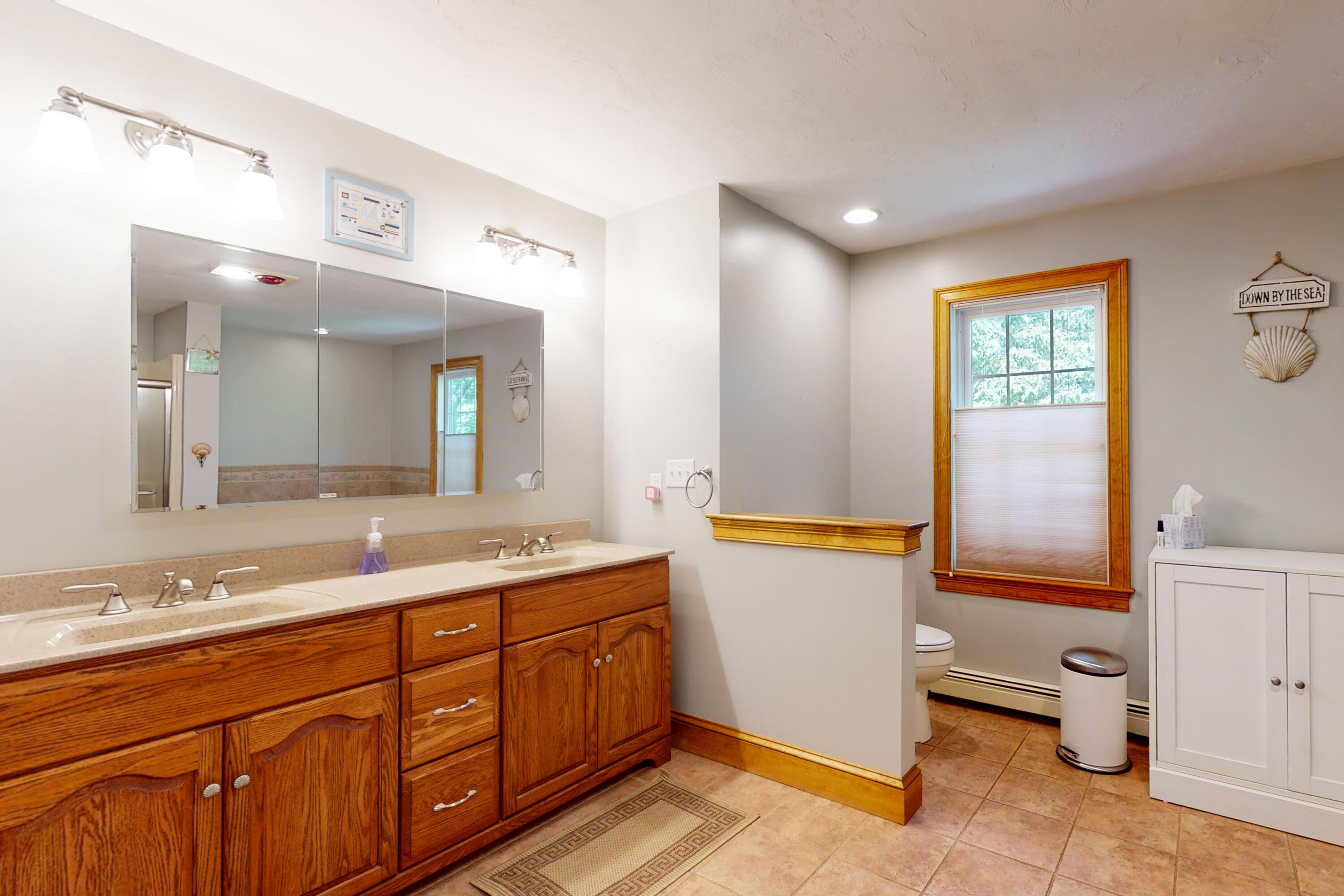 25 Fairmount Road South Dennis, MA 02660 - Photo 21 of 61 a spacious bathroom with a double vanity sink a mirror and a bathtub