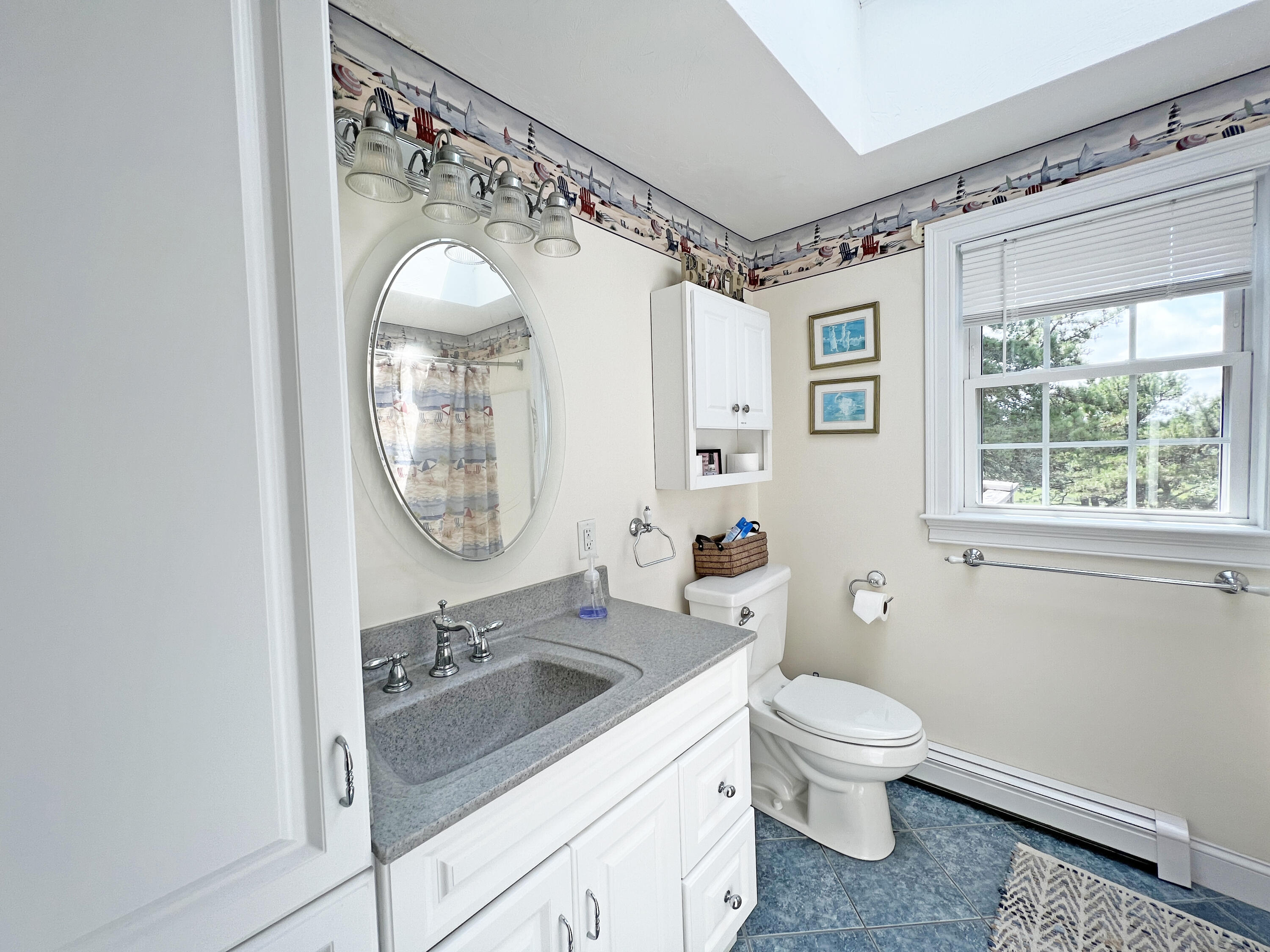 25 Fairmount Road South Dennis, MA 02660 - Photo 26 of 61 a bathroom with a sink and a mirror