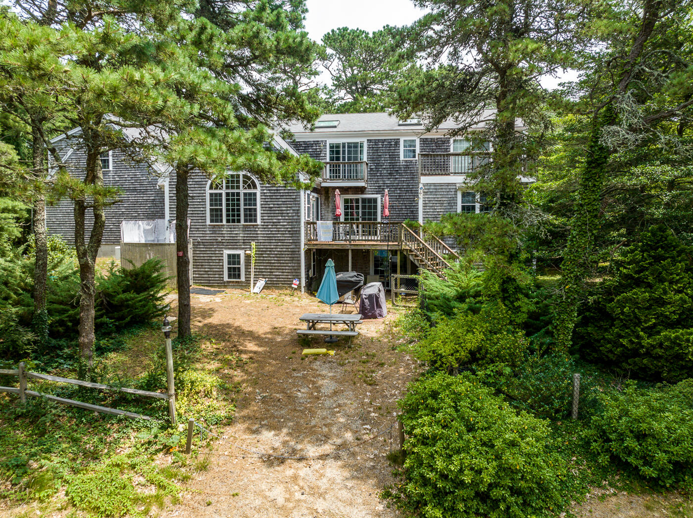 25 Fairmount Road South Dennis, MA 02660 - Photo 4 of 61 a backyard of a house with yard barbeque oven and outdoor seating