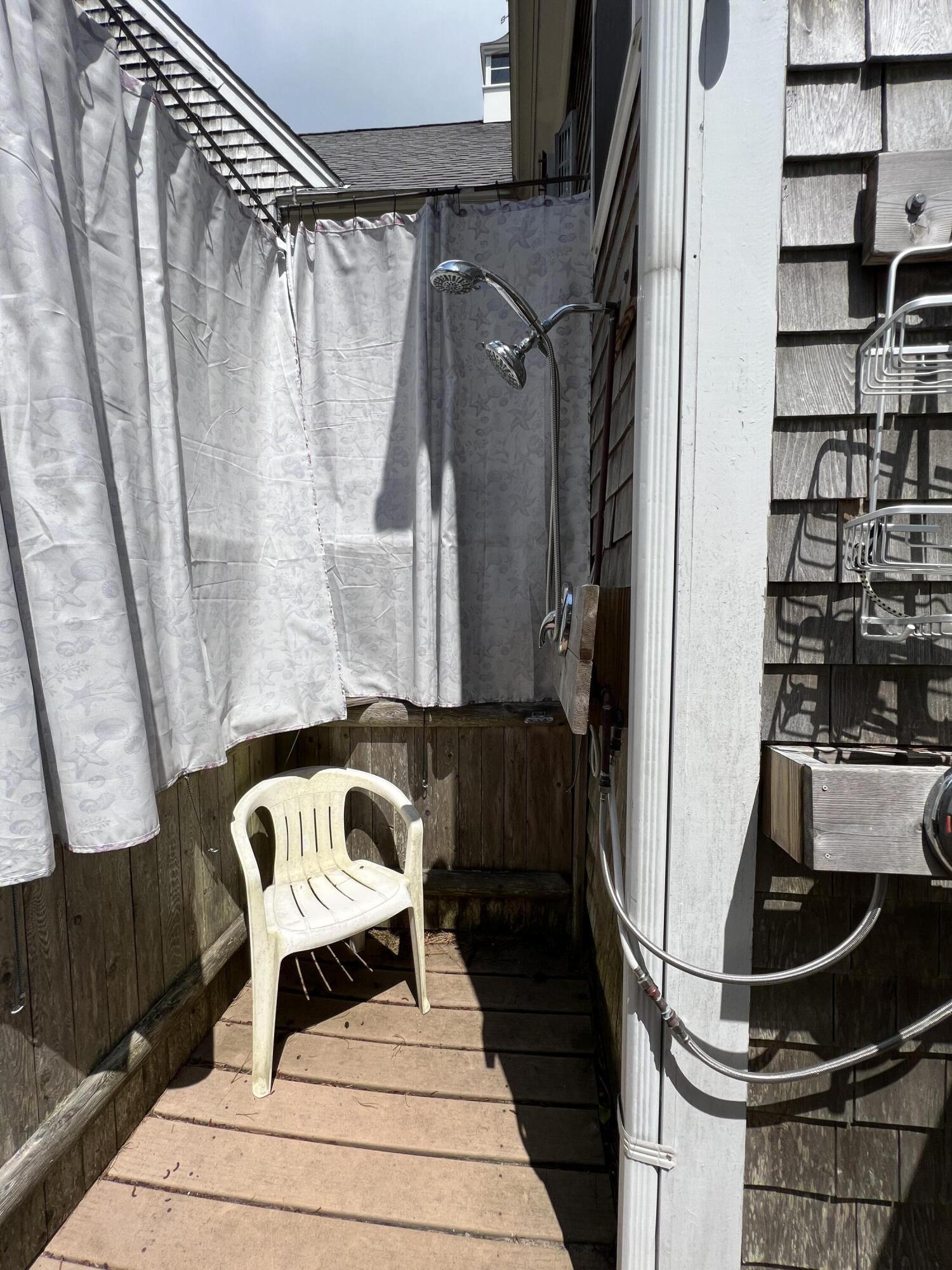 25 Fairmount Road South Dennis, MA 02660 - Photo 41 of 61 a living room with a couch and a potted plant