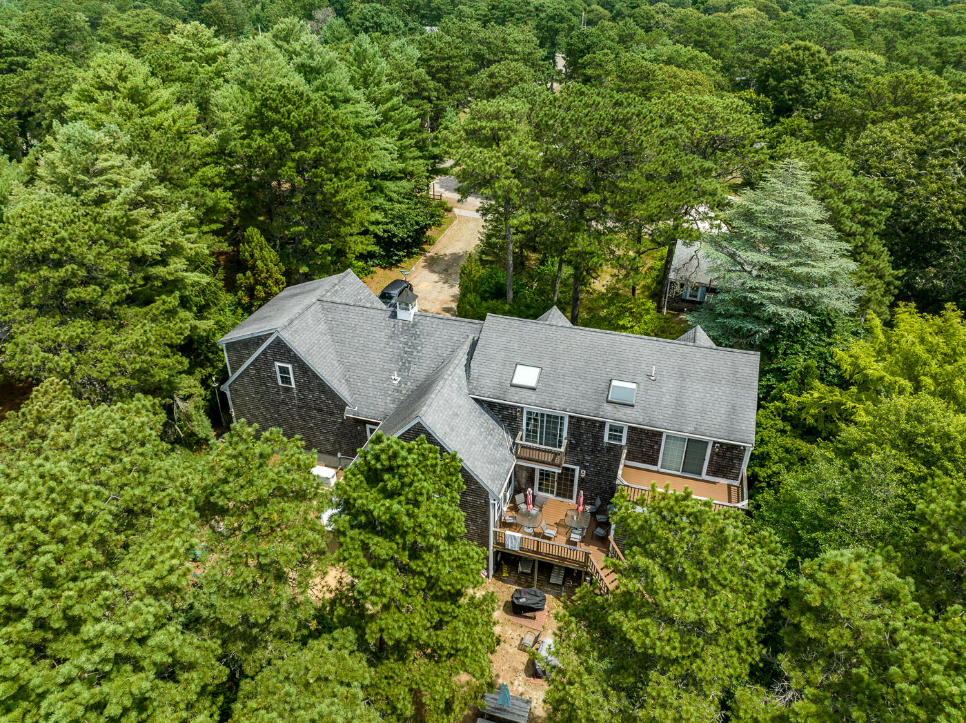 25 Fairmount Road South Dennis, MA 02660 - Photo 56 of 61 an aerial view of a house with a yard and large trees