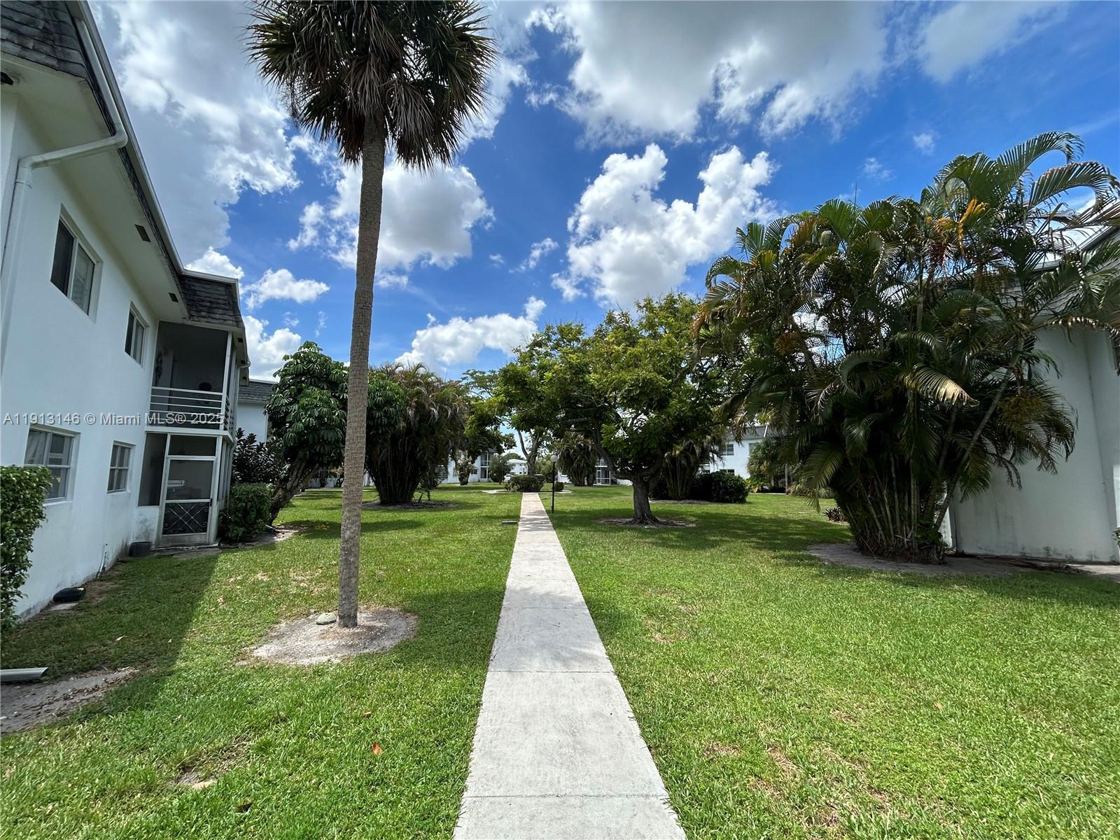 6505 Winfield Boulevard, Unit B18 Margate, FL 33063 - Photo 14 of 15 a view of a backyard with green space
