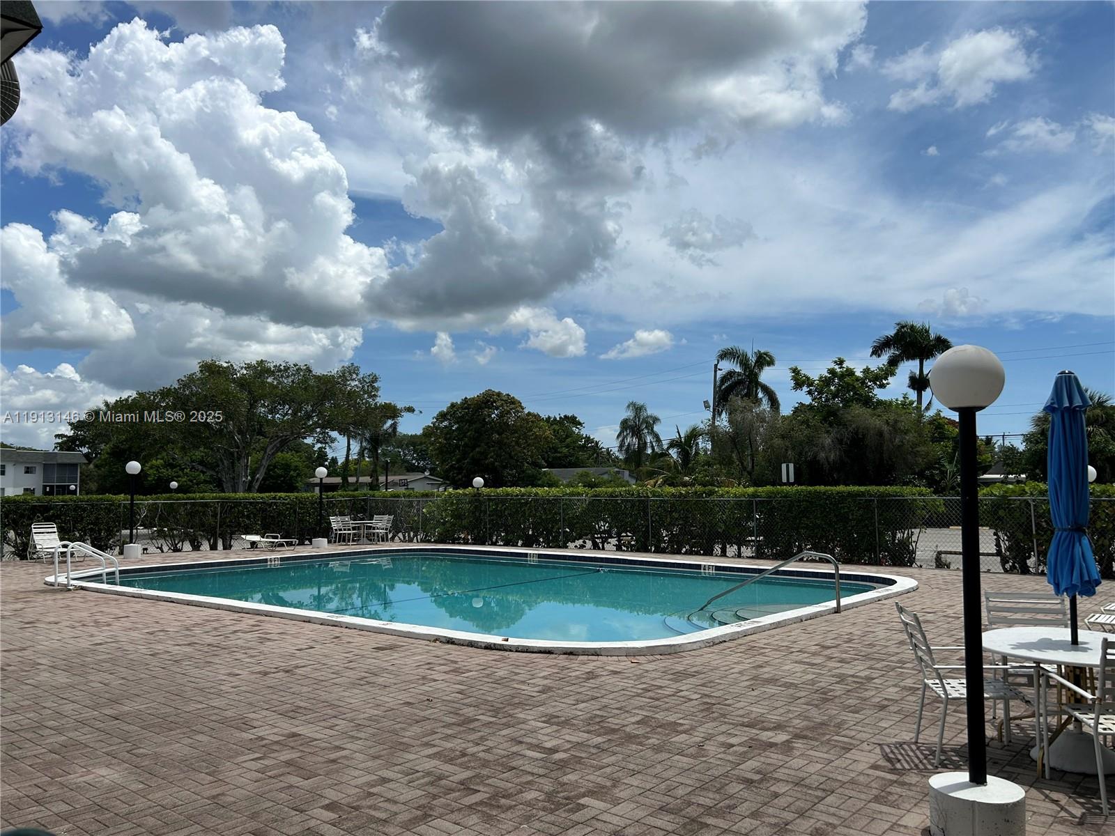 6505 Winfield Boulevard, Unit B18 Margate, FL 33063 - Photo 10 of 15 a view of a fountain in front of a house