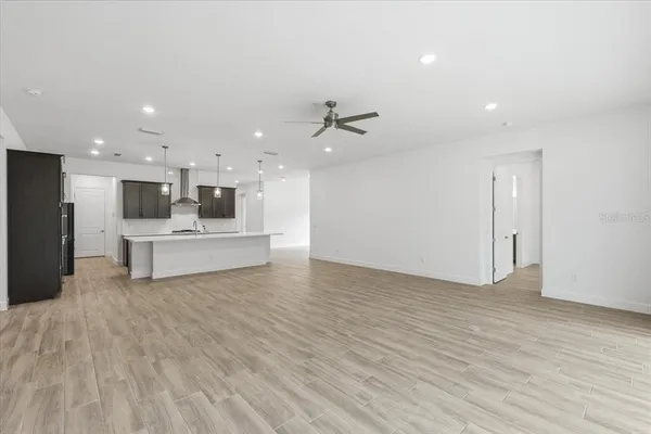 a view of kitchen with wooden floor
