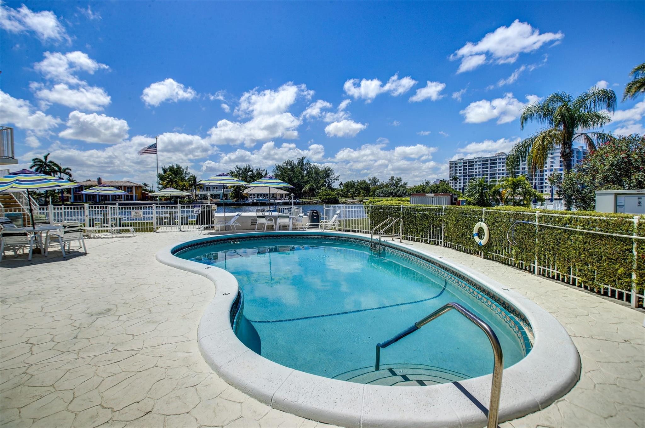 999 North Riverside Drive, Unit 11 Pompano Beach, FL 33062 - Photo 11 of 12 a view of a swimming pool with a patio