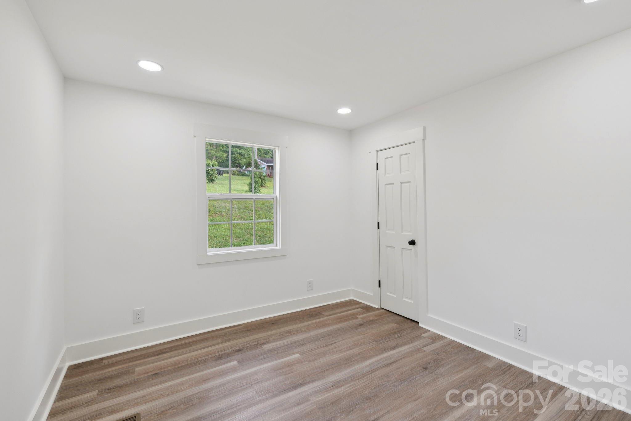 431 Pole Miller Extension Brevard, NC 28712 - Photo 12 of 24 a view of a room with wooden floor and window
