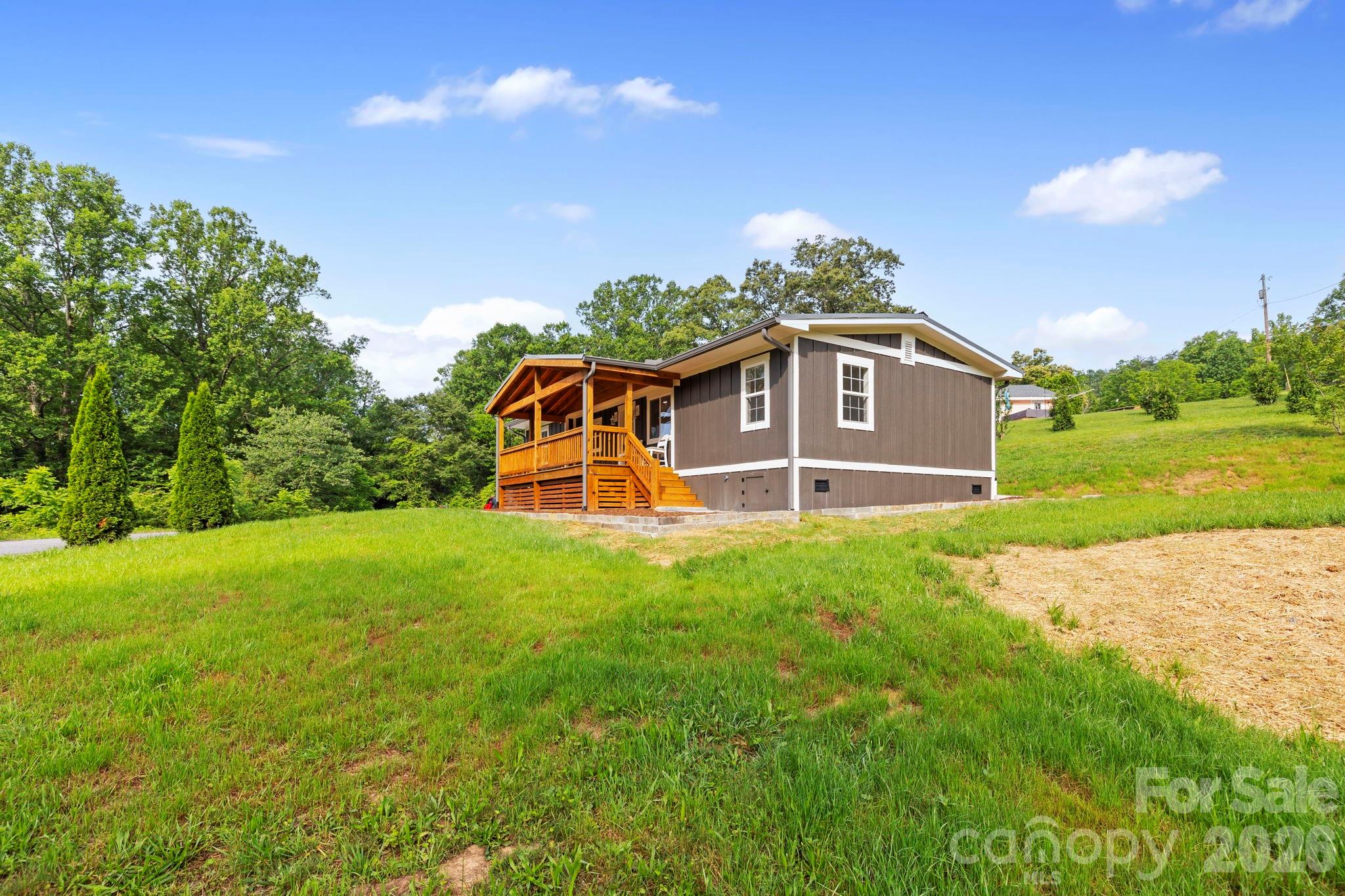 431 Pole Miller Extension Brevard, NC 28712 - Photo 24 of 24 a front view of a house with a yard