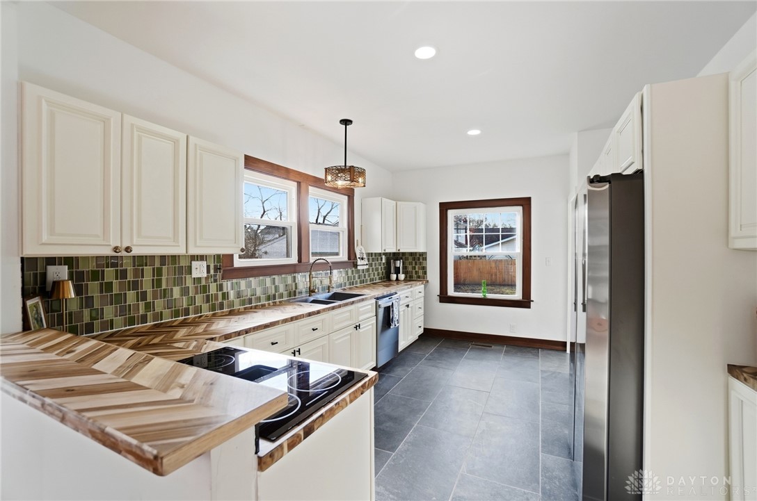 25 Englewood Road Springfield, OH 45504 - Photo 14 of 66 This bright kitchen features sleek appliances and ample counter space, perfect for culinary endeavors.