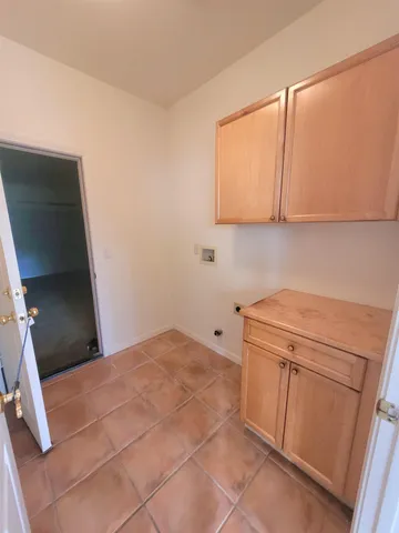 a kitchen with a sink and a refrigerator