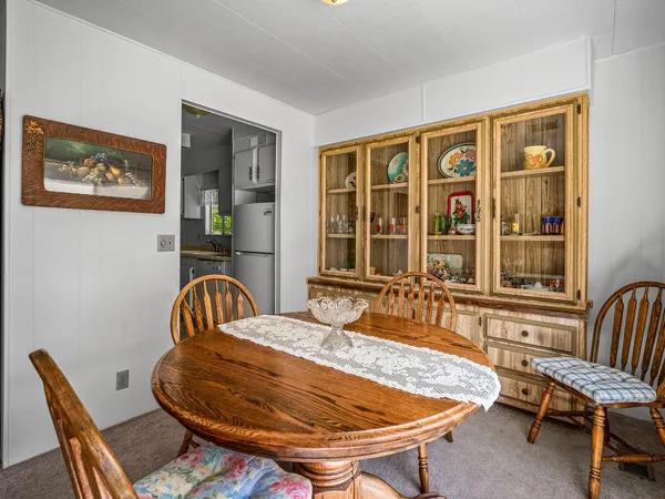 a bedroom with furniture and large windows