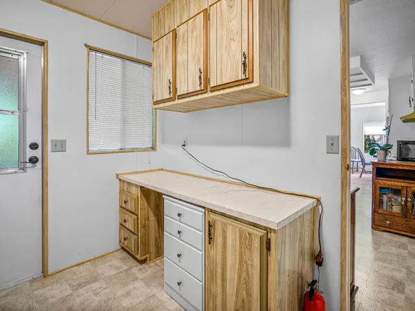 a bedroom with bed and window