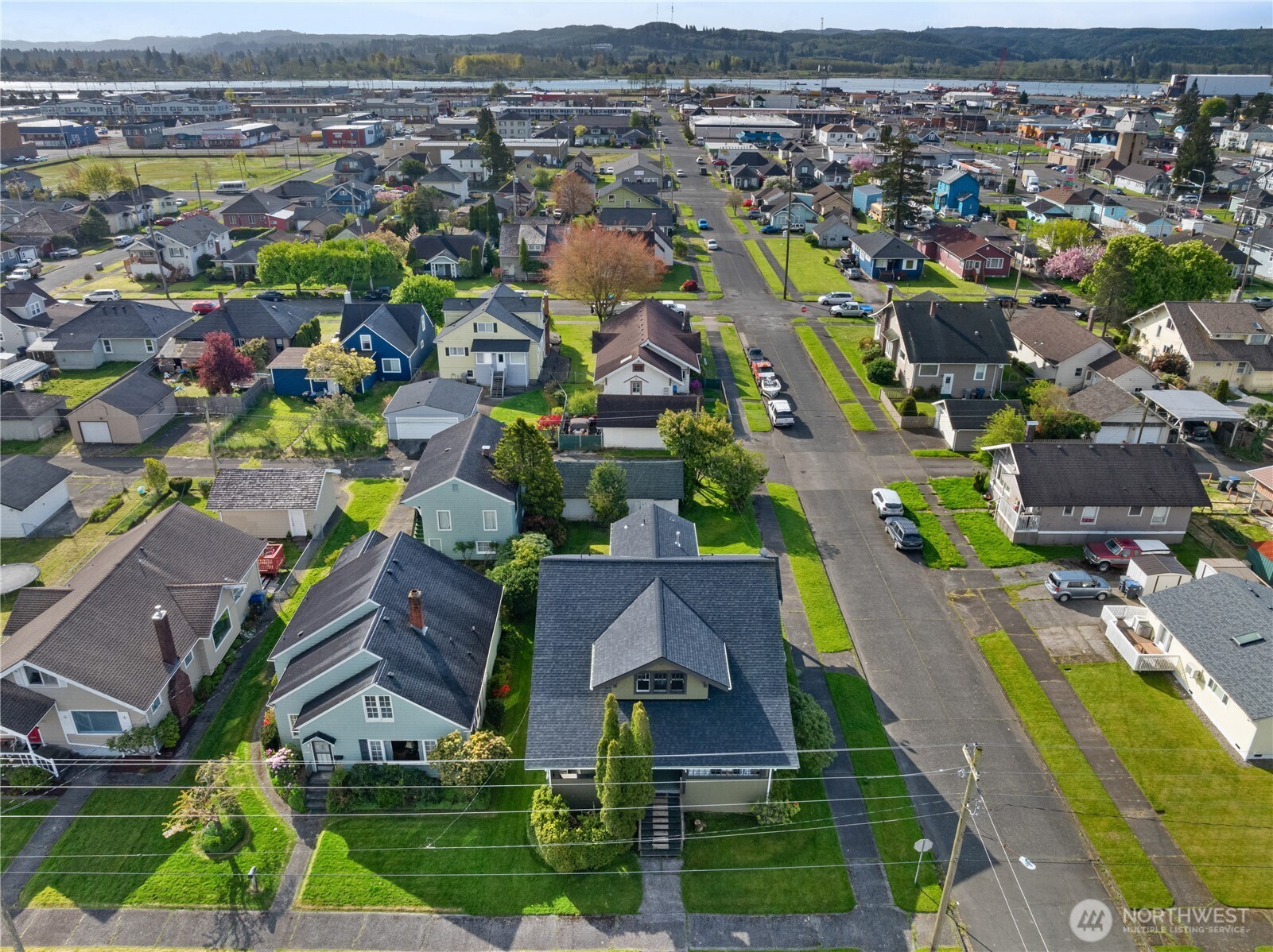 521 West 3rd Street Aberdeen, WA 98520 - Photo 11 of 13 an aerial view of residential houses with outdoor space and river view