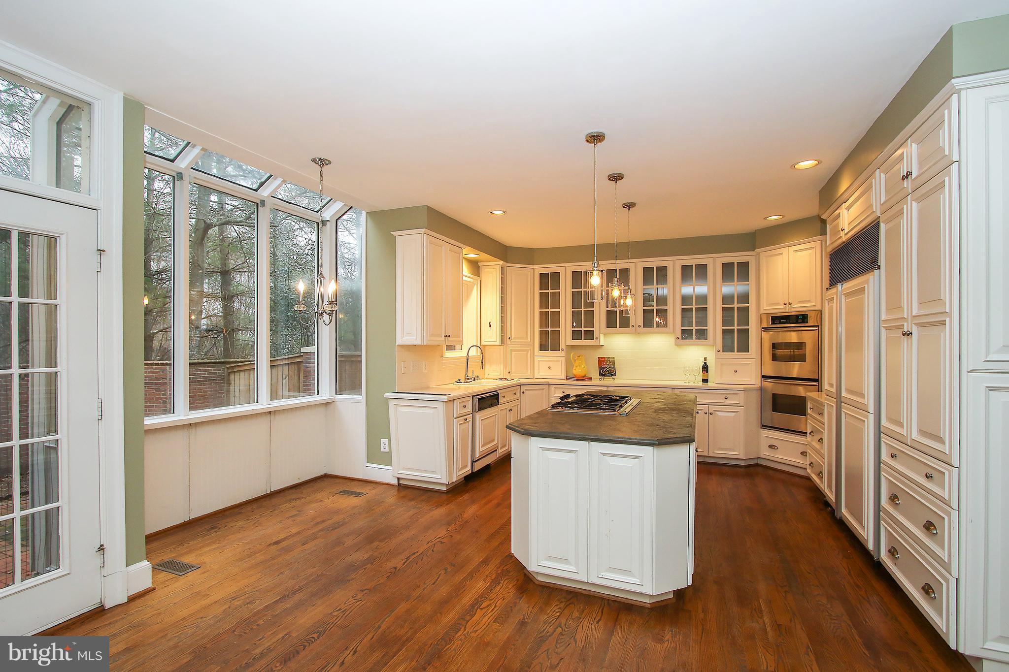 7900 Quarry Ridge Way Bethesda, MD 20817 - Photo 11 of 30 a kitchen with stainless steel appliances granite countertop a stove and a refrigerator