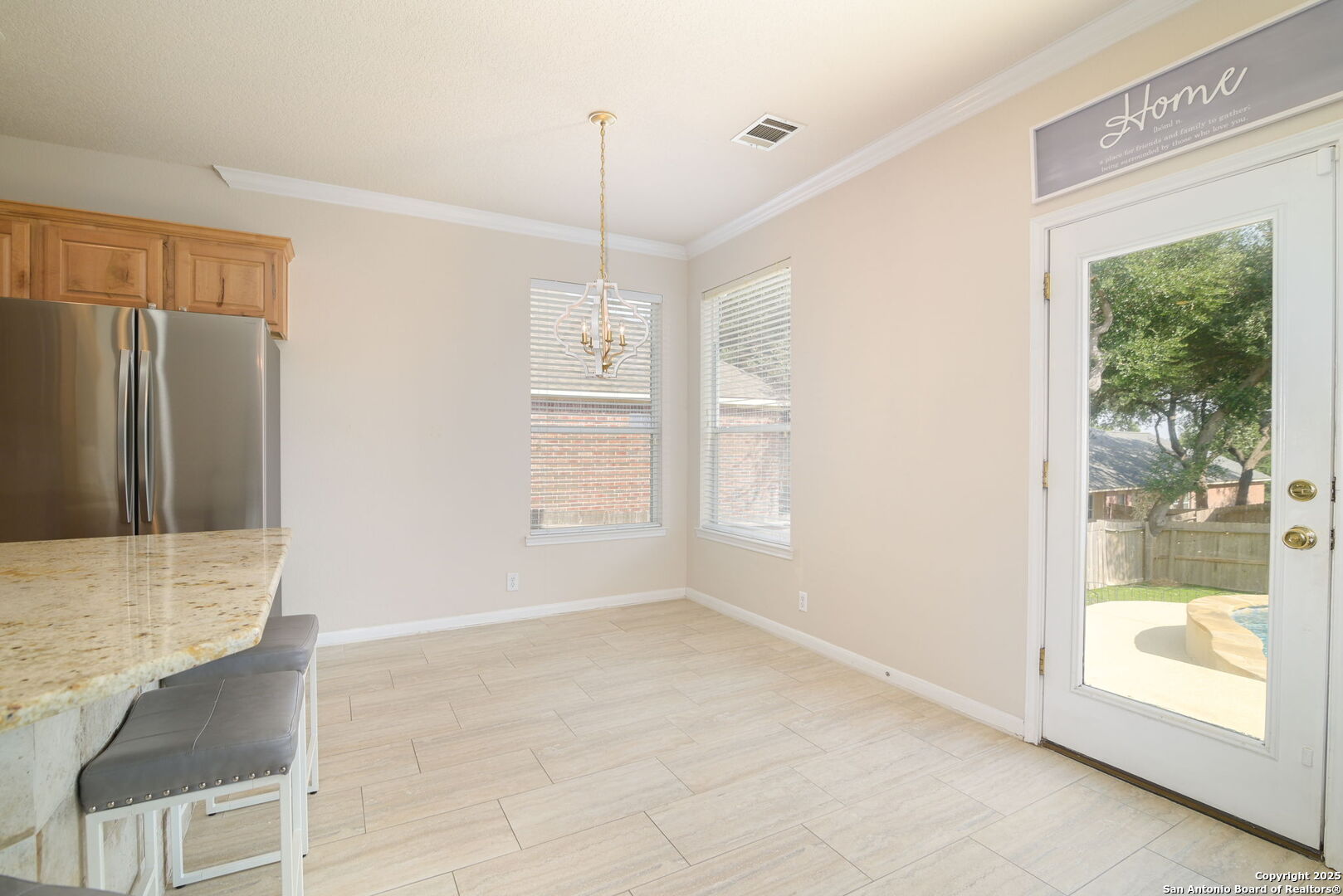 8918 Cordes Junction Helotes, TX 78023 - Photo 15 of 41 a view of an empty room with wooden floor and a window