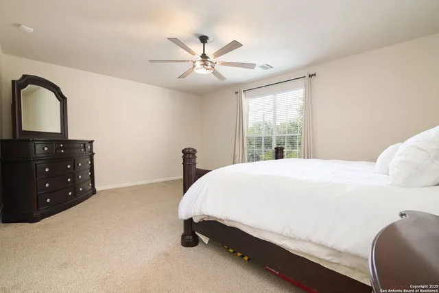 a bed room with a bed and a dresser