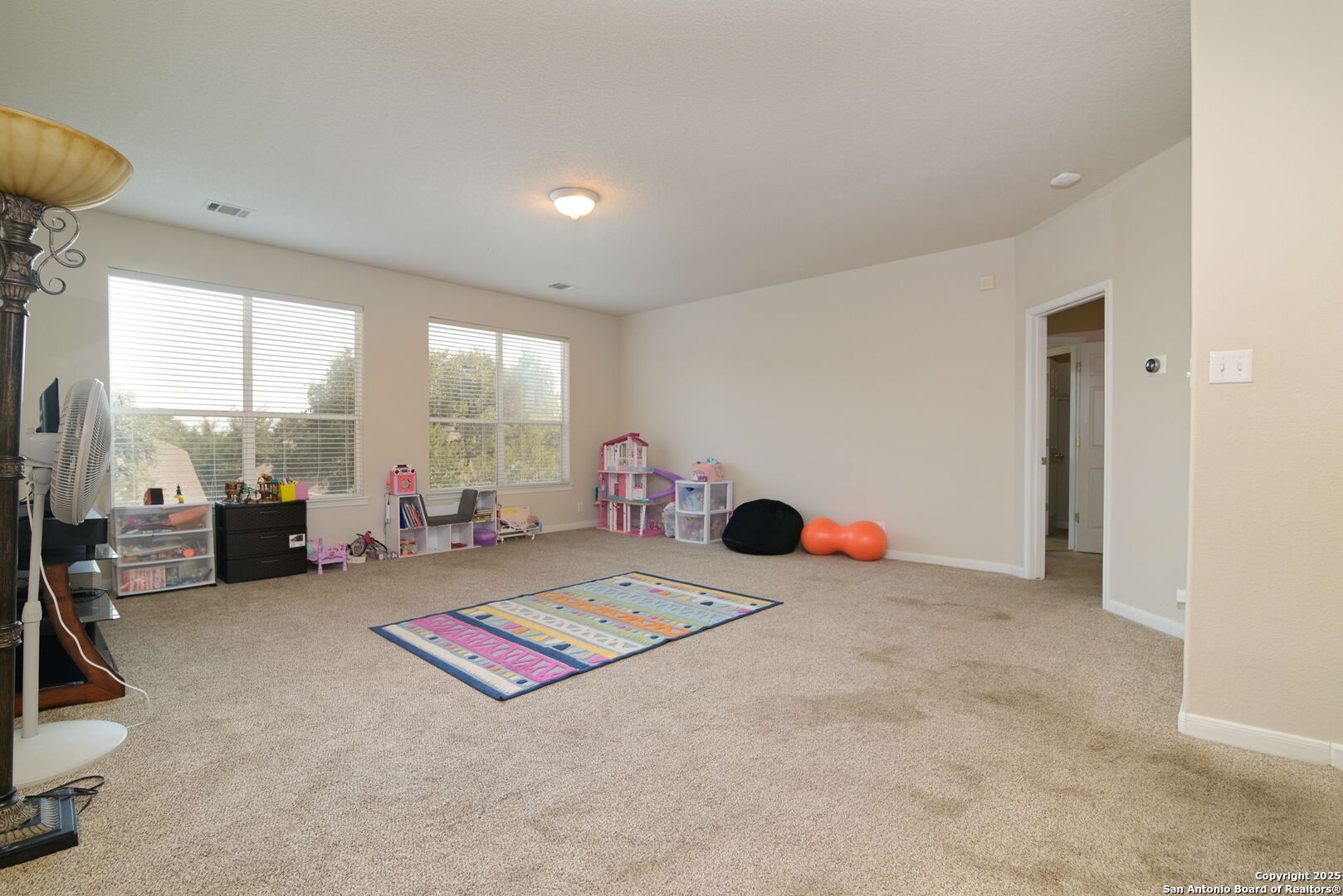 8918 Cordes Junction Helotes, TX 78023 - Photo 21 of 41 a living room with furniture and a floor to ceiling window