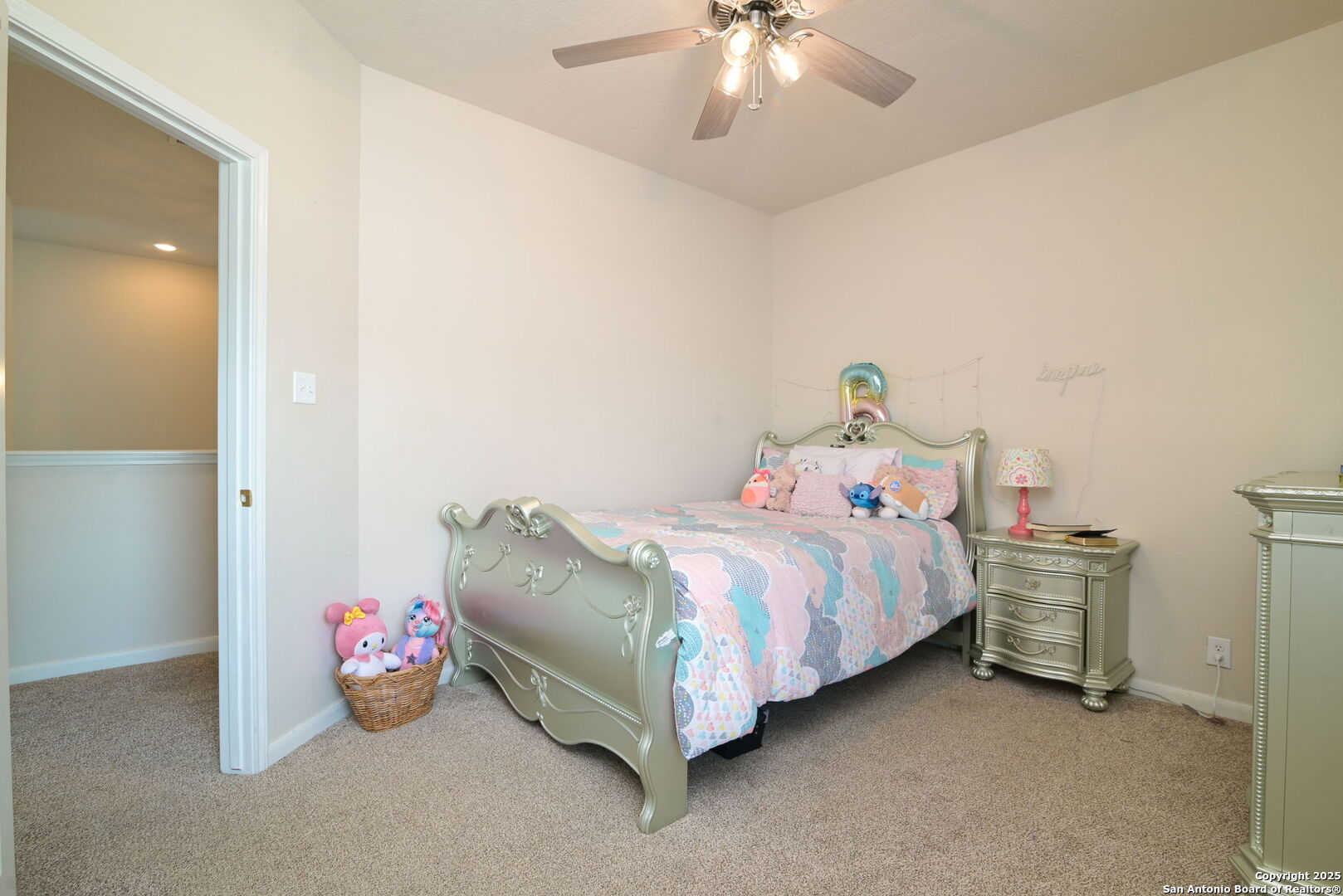 8918 Cordes Junction Helotes, TX 78023 - Photo 23 of 41 a bedroom with a bed and a chandelier