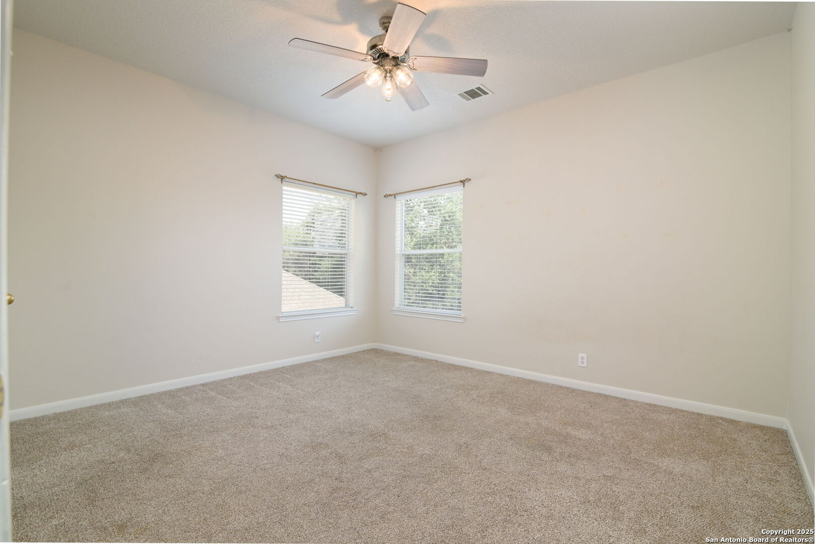 8918 Cordes Junction Helotes, TX 78023 - Photo 25 of 41 wooden floor in an empty room with a window
