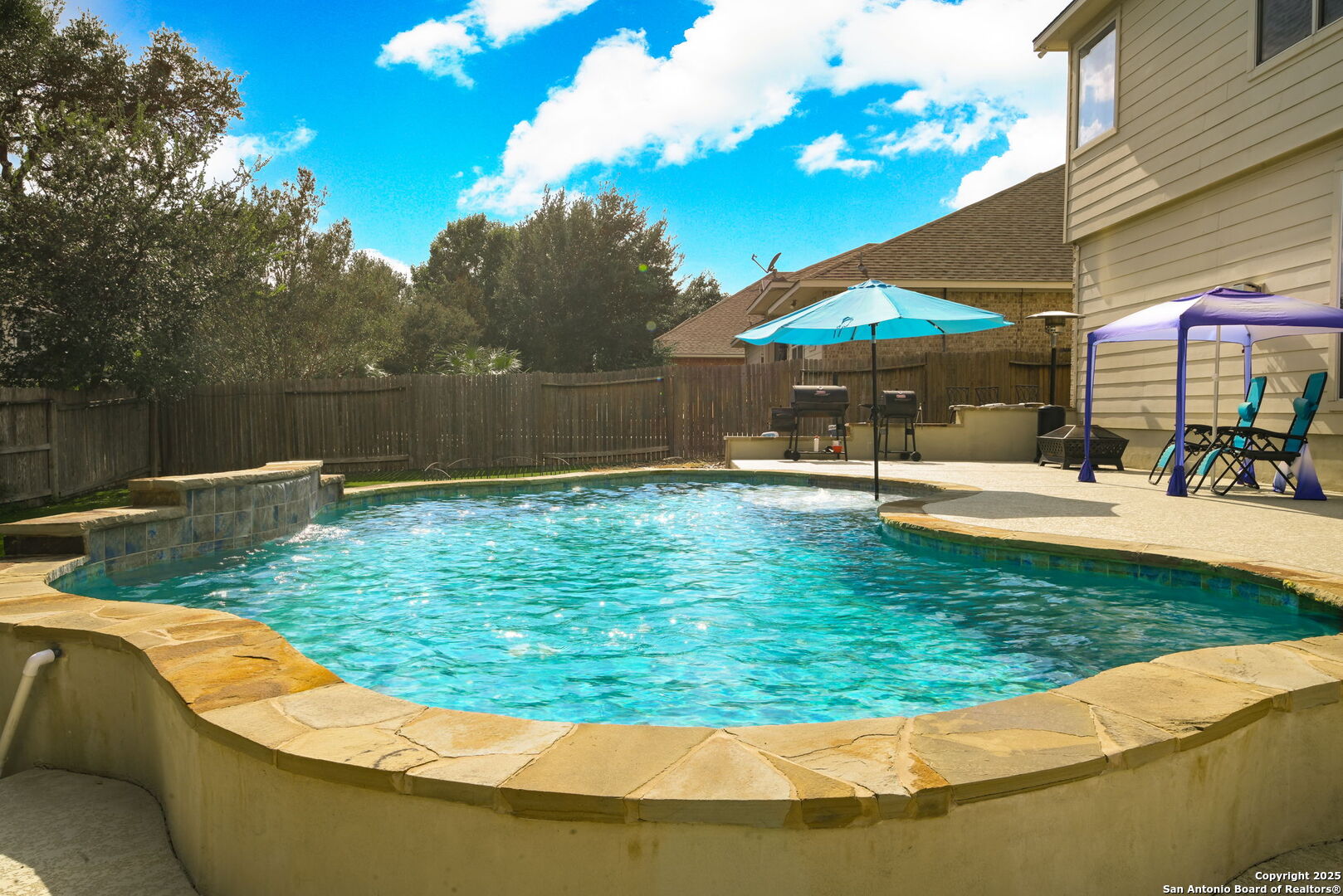 8918 Cordes Junction Helotes, TX 78023 - Photo 28 of 41 a view of a swimming pool with a patio