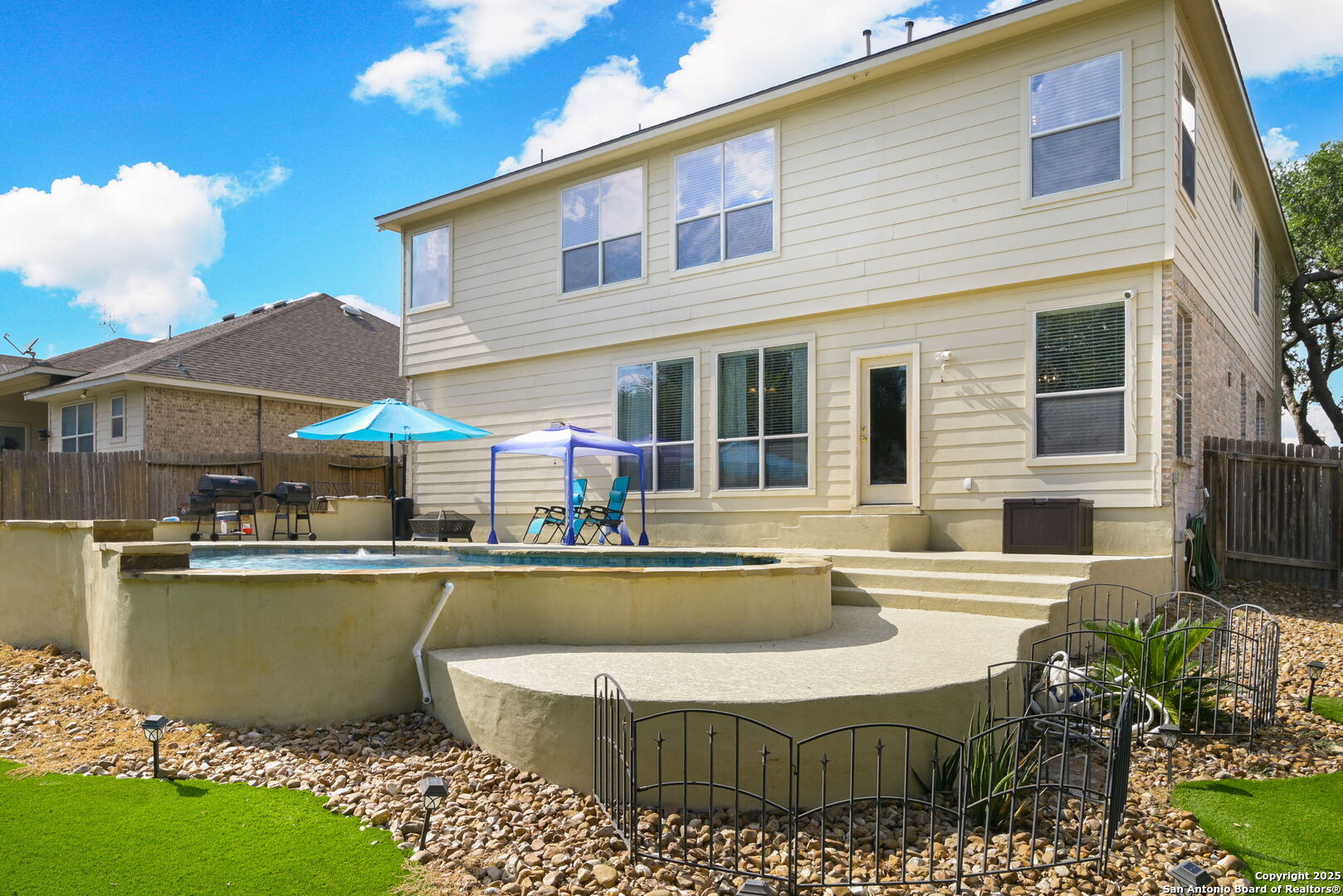 8918 Cordes Junction Helotes, TX 78023 - Photo 31 of 41 a view of a house with swimming pool and a chairs in patio