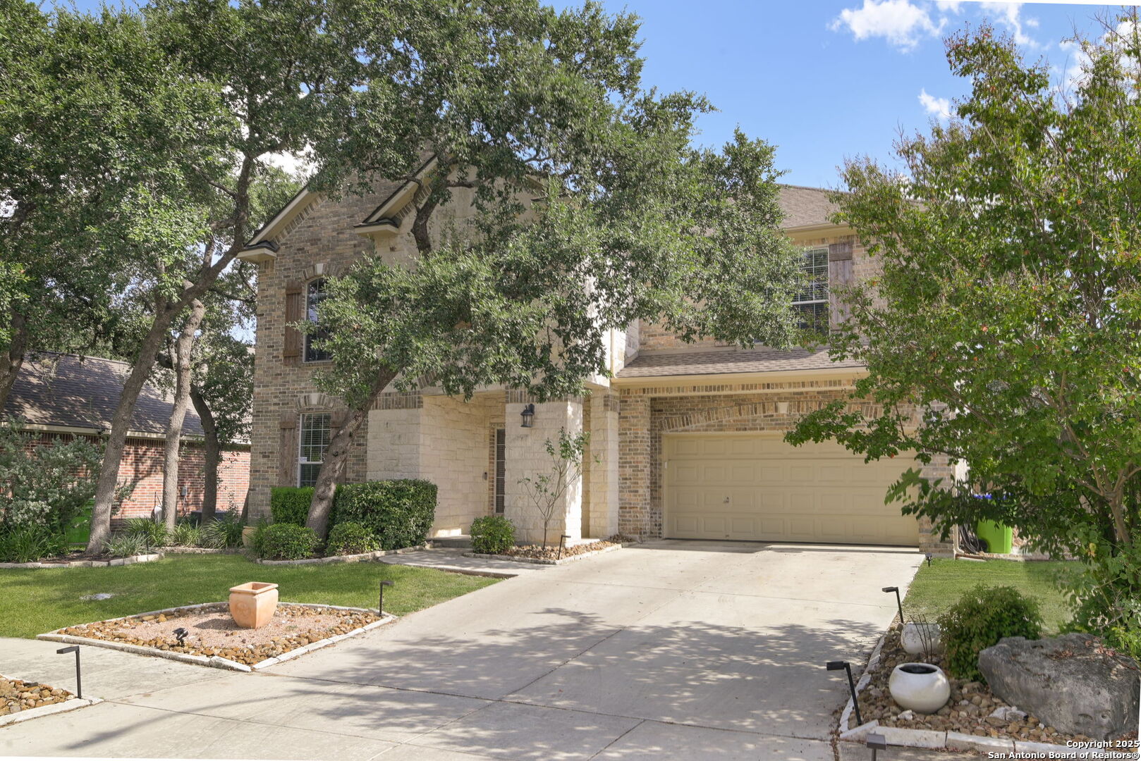 8918 Cordes Junction Helotes, TX 78023 - Photo 32 of 41 a front view of a house with a yard and garage