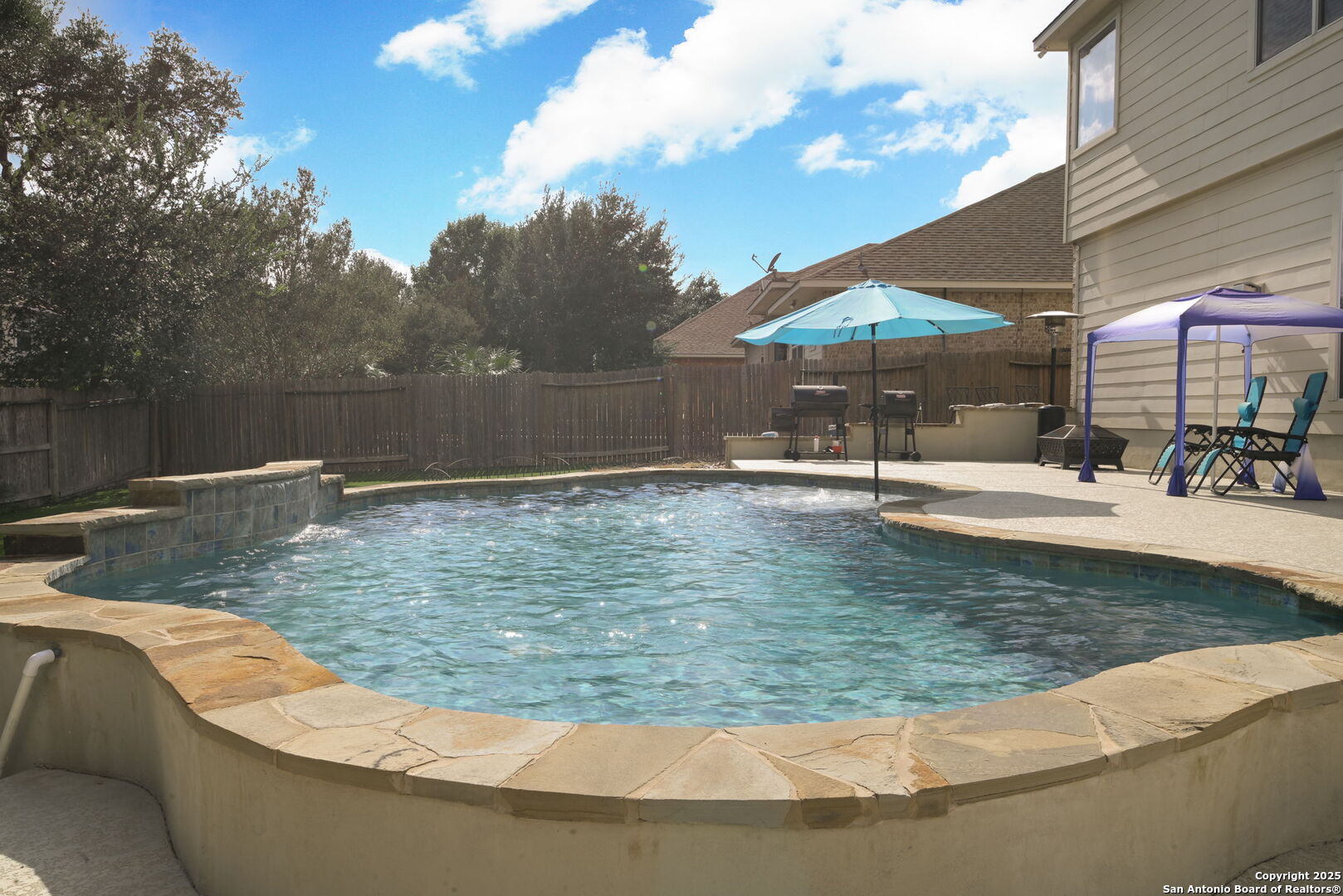 8918 Cordes Junction Helotes, TX 78023 - Photo 37 of 41 a view of a swimming pool with a patio