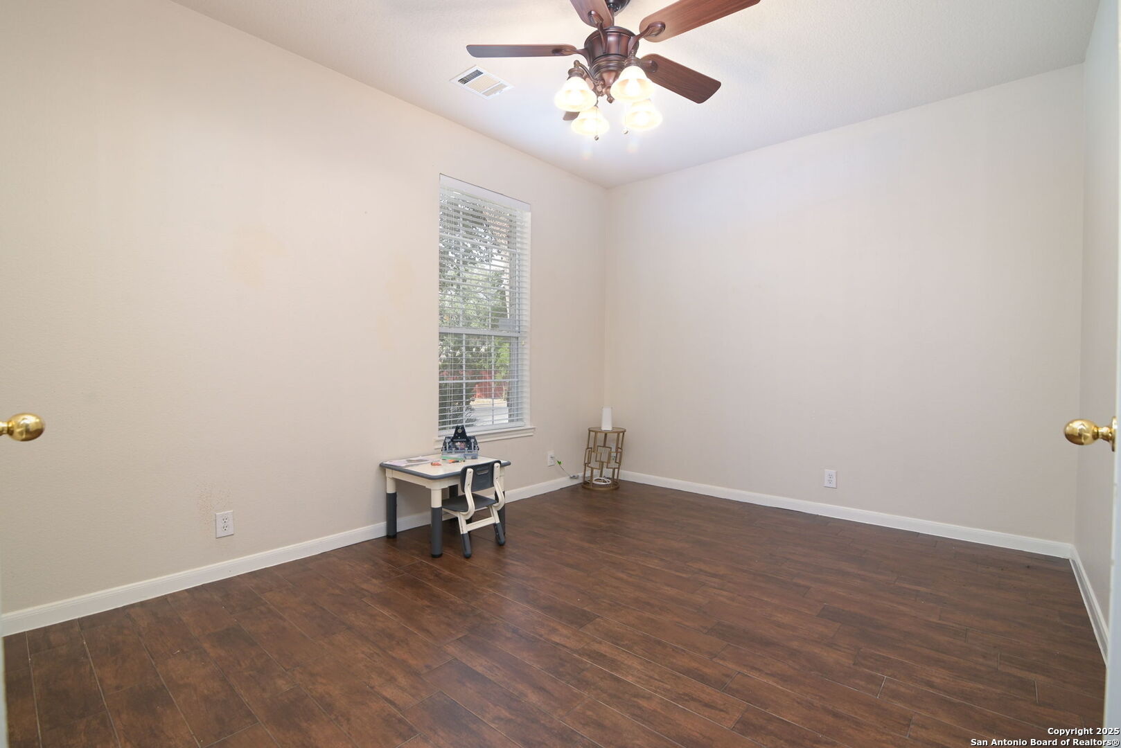 8918 Cordes Junction Helotes, TX 78023 - Photo 7 of 41 an empty room with wooden floor fan and windows