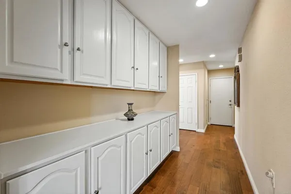 a kitchen with white cabinets