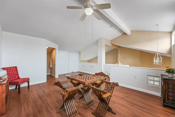 a bedroom with furniture and wooden floor