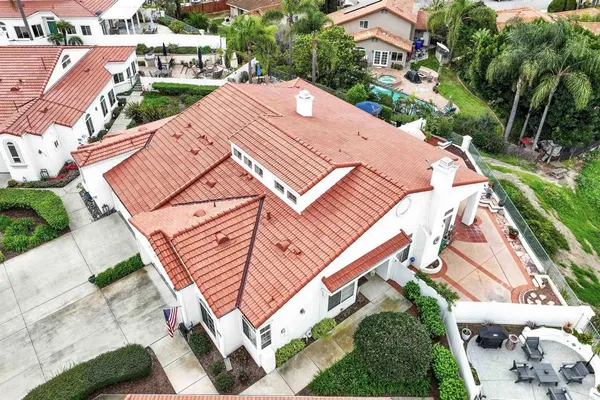 an aerial view of a house with a yard