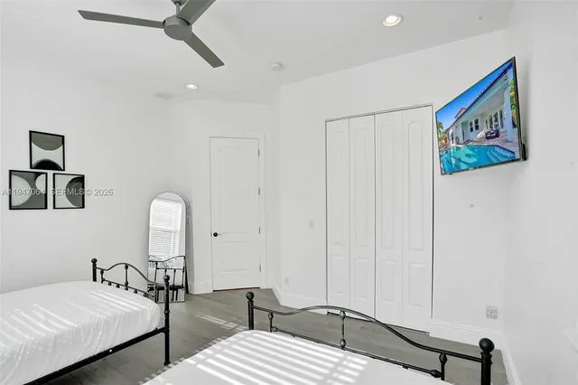 a bedroom with furniture and windows