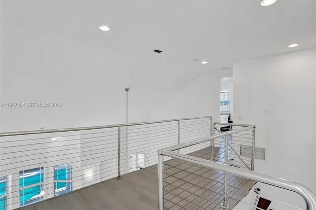 a view of room with wooden floor