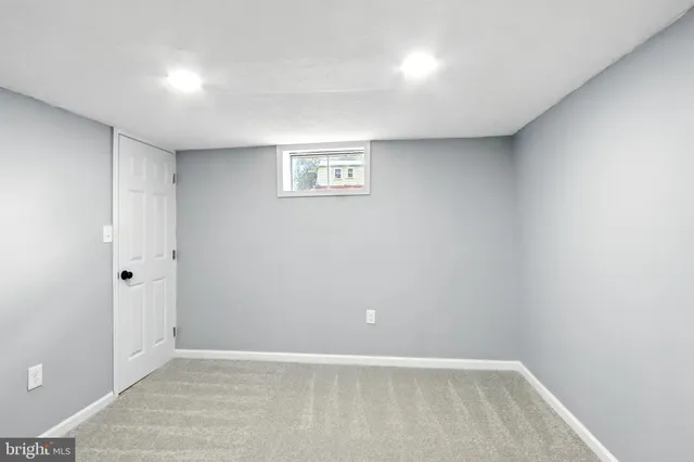 a bathroom with a mirror and a shower