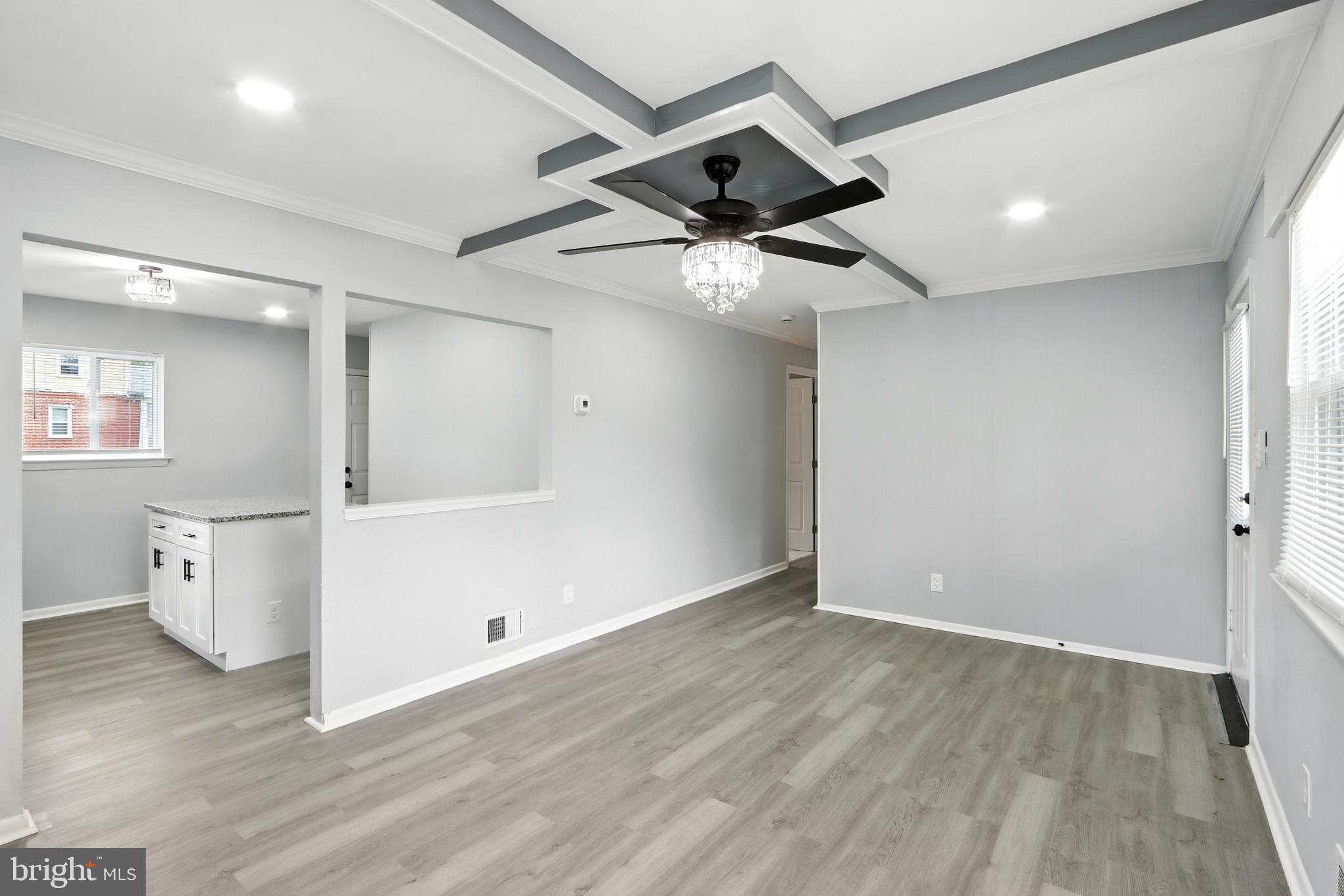 6603 Fairmount Avenue Baltimore, MD 21215 - Photo 2 of 19 a view of an empty room and wooden floor