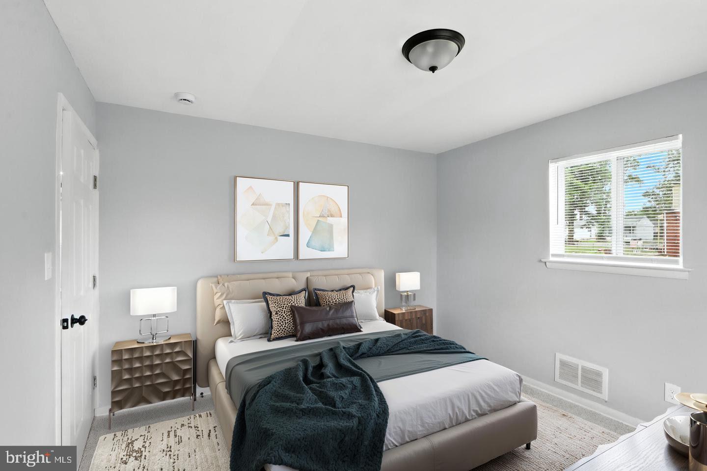 6603 Fairmount Avenue Baltimore, MD 21215 - Photo 6 of 19 a bedroom with a bed and a window