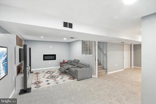 a view of an empty room with a workspace