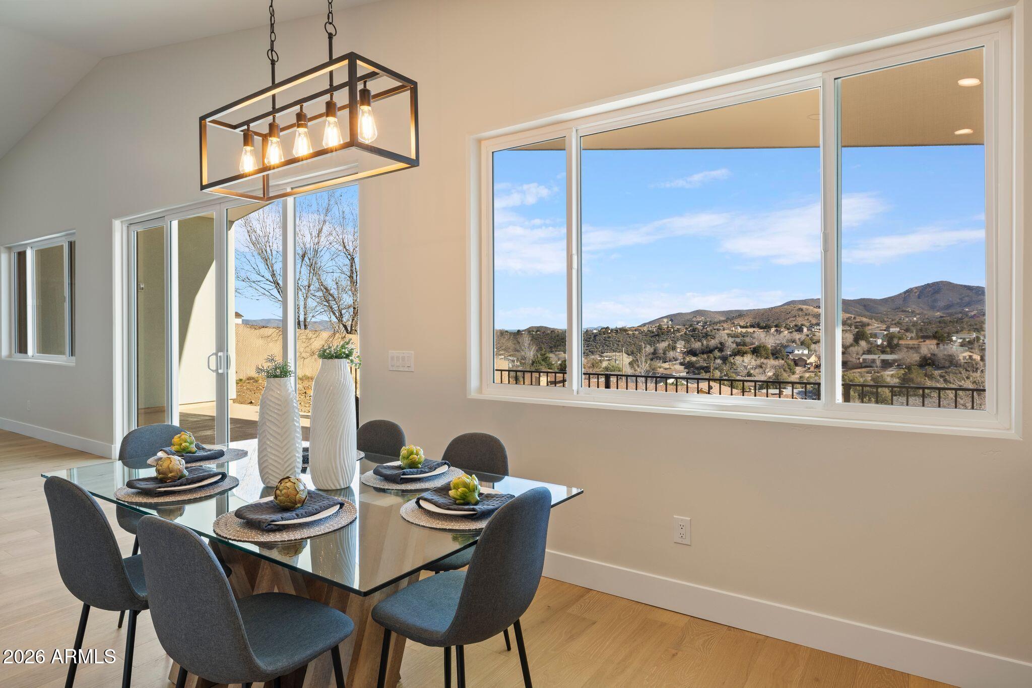 4535 Victor Drive Prescott, AZ 86301 - Photo 11 of 43 a dining room with furniture a chandelier and wooden floor