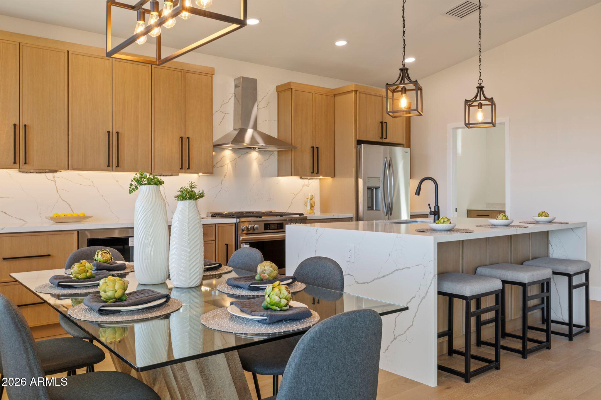 4535 Victor Drive Prescott, AZ 86301 - Photo 13 of 43 a kitchen with a sink dining table and chairs