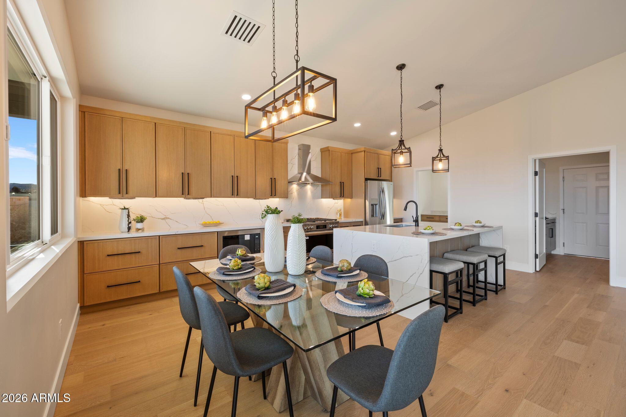 4535 Victor Drive Prescott, AZ 86301 - Photo 14 of 43 a view of a dining room with furniture and chandelier