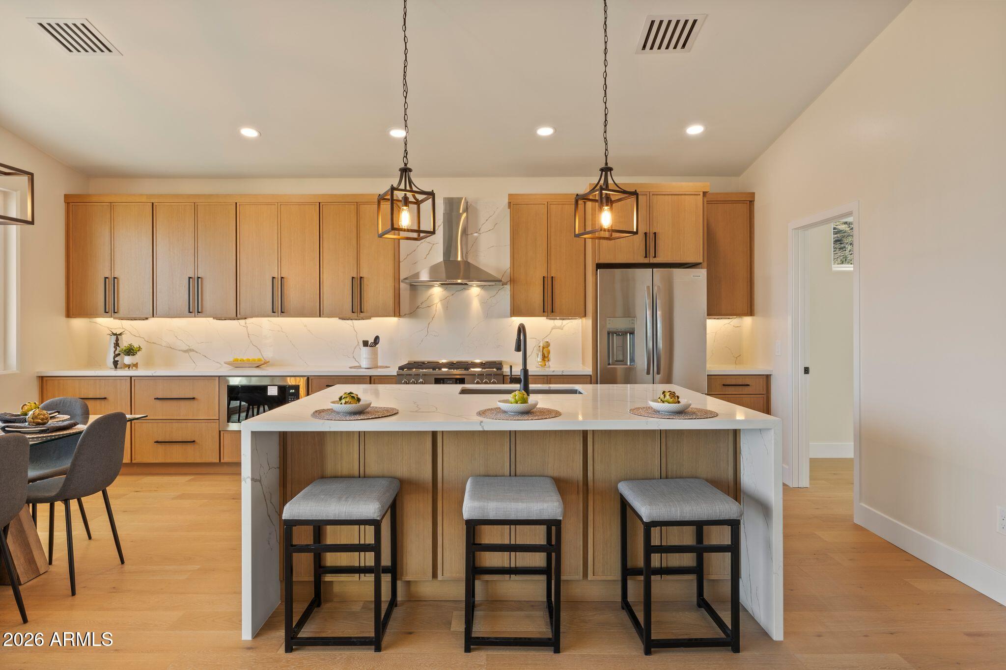 4535 Victor Drive Prescott, AZ 86301 - Photo 15 of 43 a kitchen with a table chairs stove and refrigerator