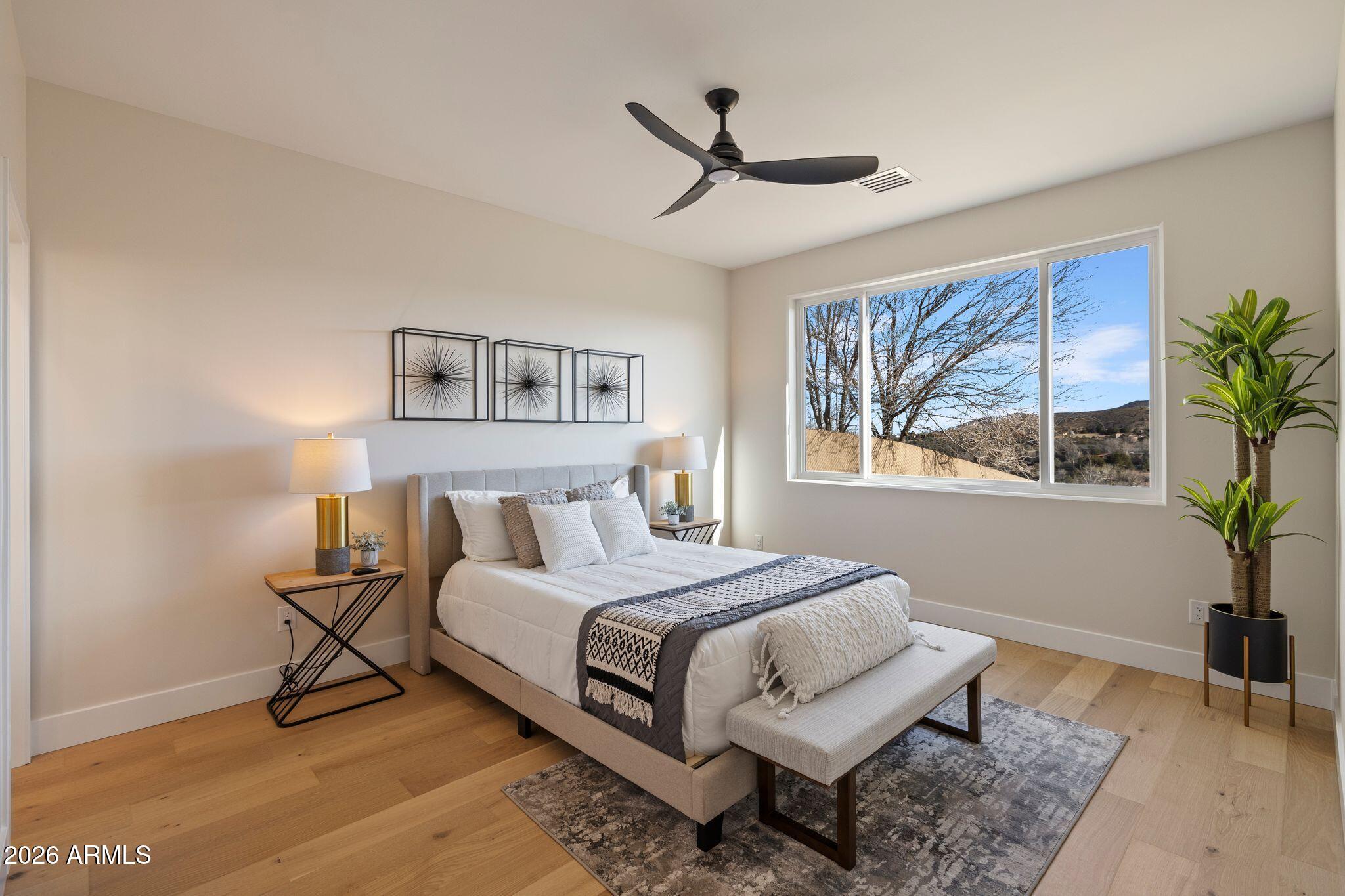 4535 Victor Drive Prescott, AZ 86301 - Photo 18 of 43 a bedroom with a large bed and a window