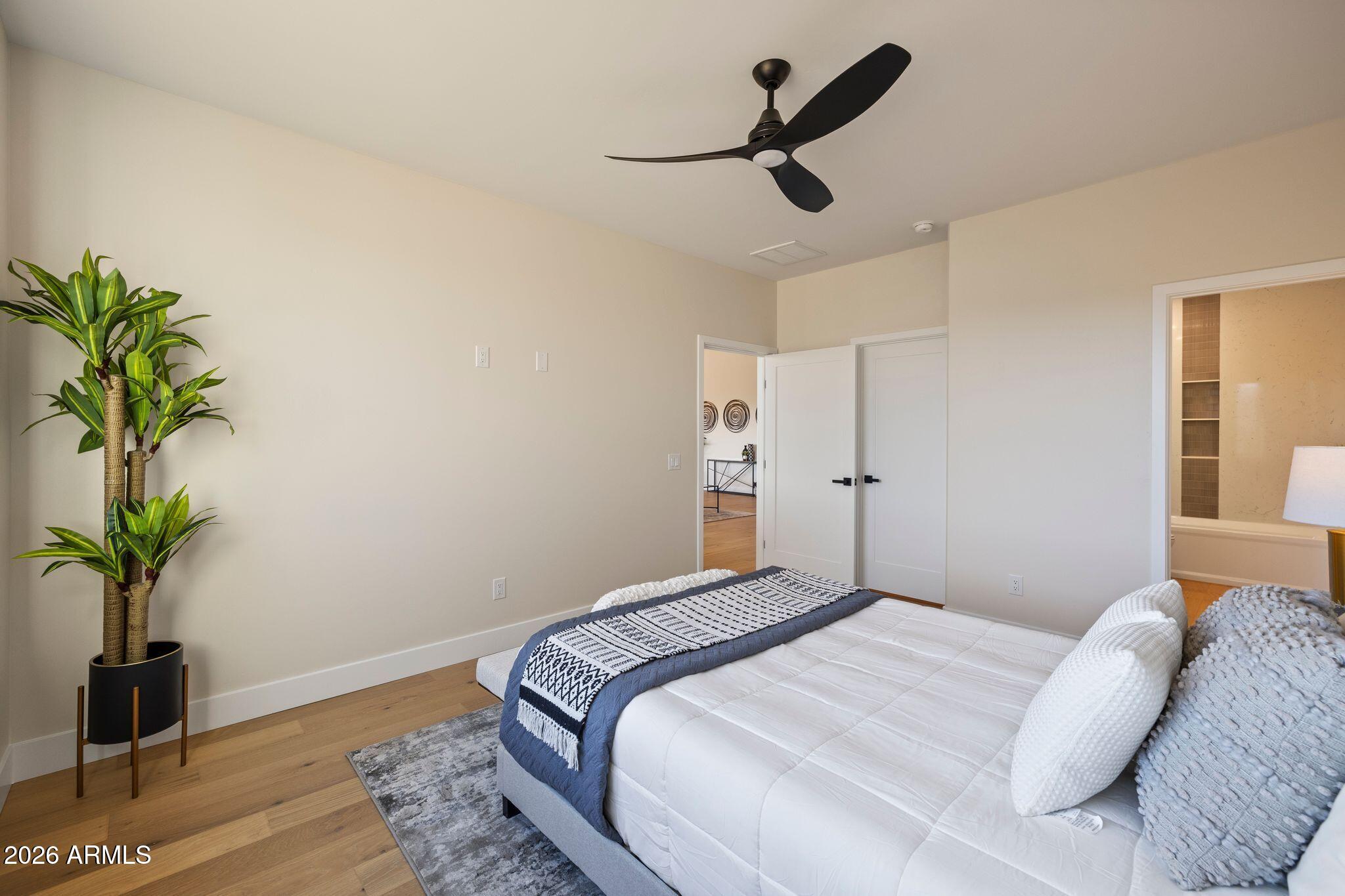 4535 Victor Drive Prescott, AZ 86301 - Photo 19 of 43 a bedroom with a bed and a potted plant