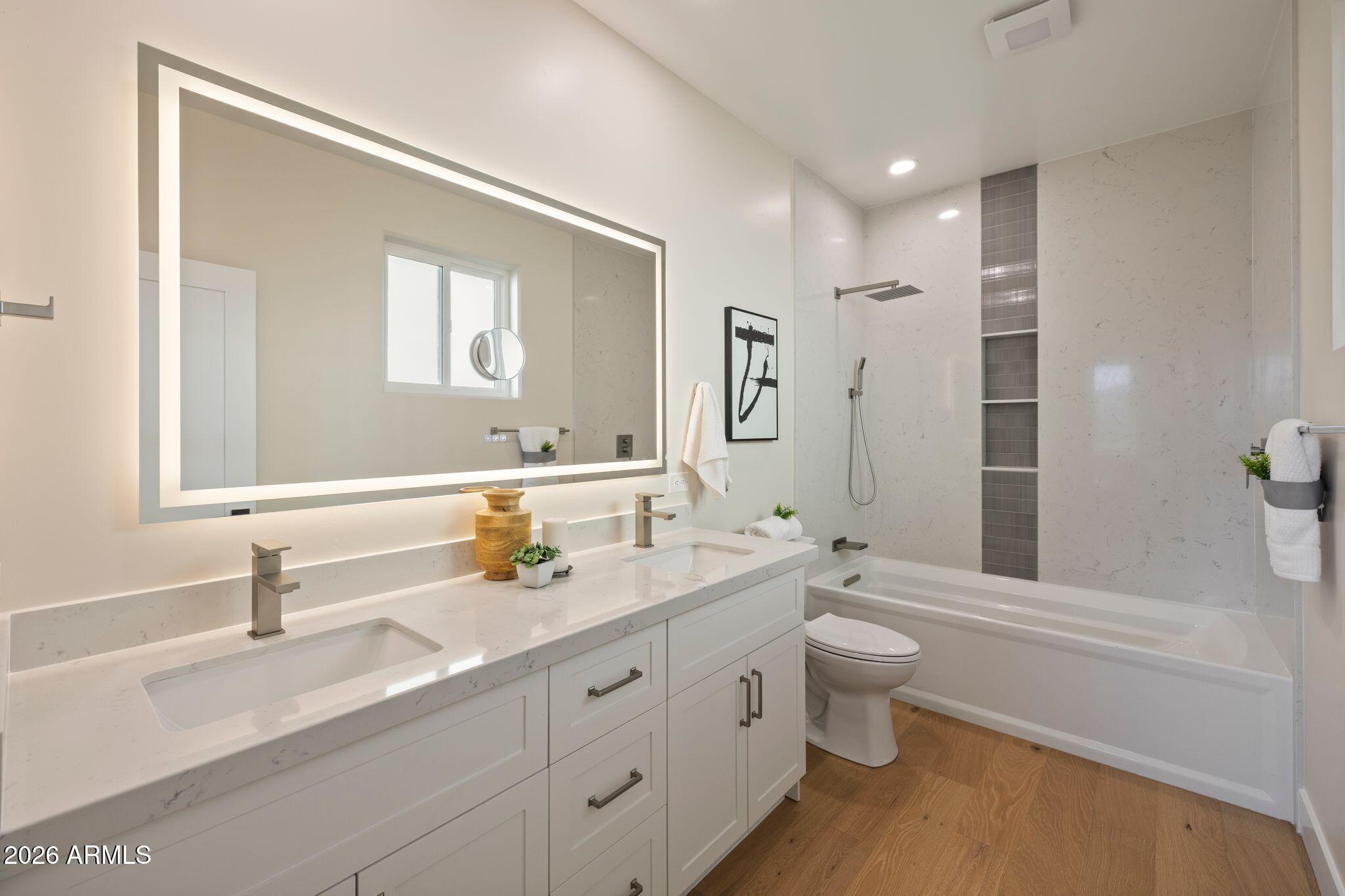 4535 Victor Drive Prescott, AZ 86301 - Photo 20 of 43 a bathroom with a double vanity sink toilet and mirror