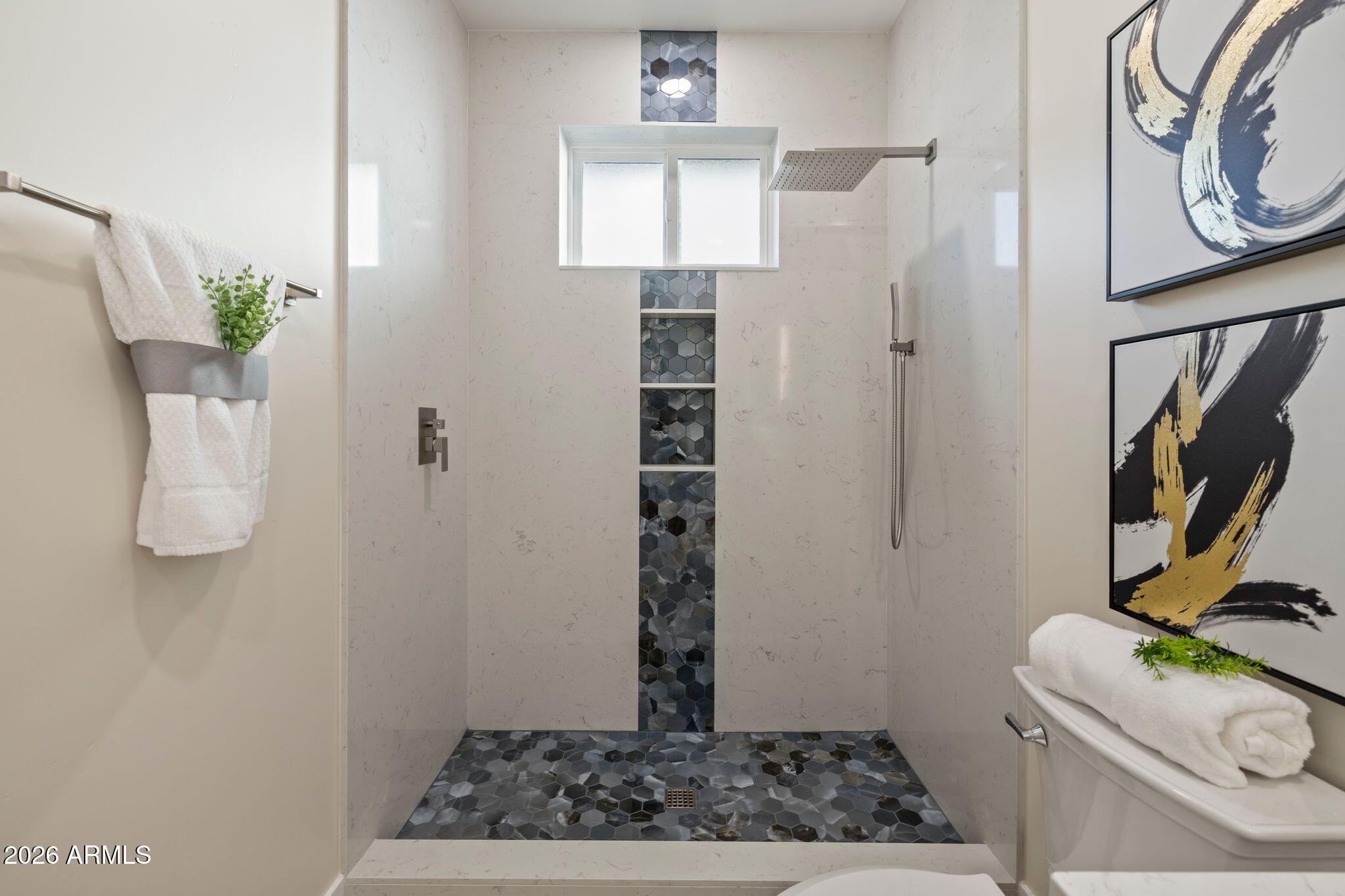 4535 Victor Drive Prescott, AZ 86301 - Photo 25 of 43 a bathroom with a window a light fixture and a window