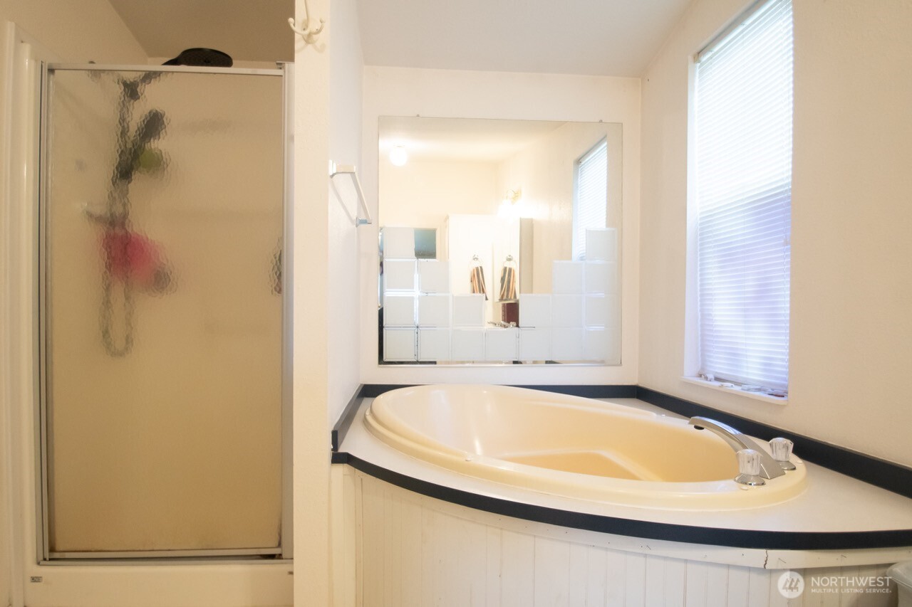 307 South 3rd Street Pe Ell, WA 98572 - Photo 14 of 29 a bathroom with a tub and shower